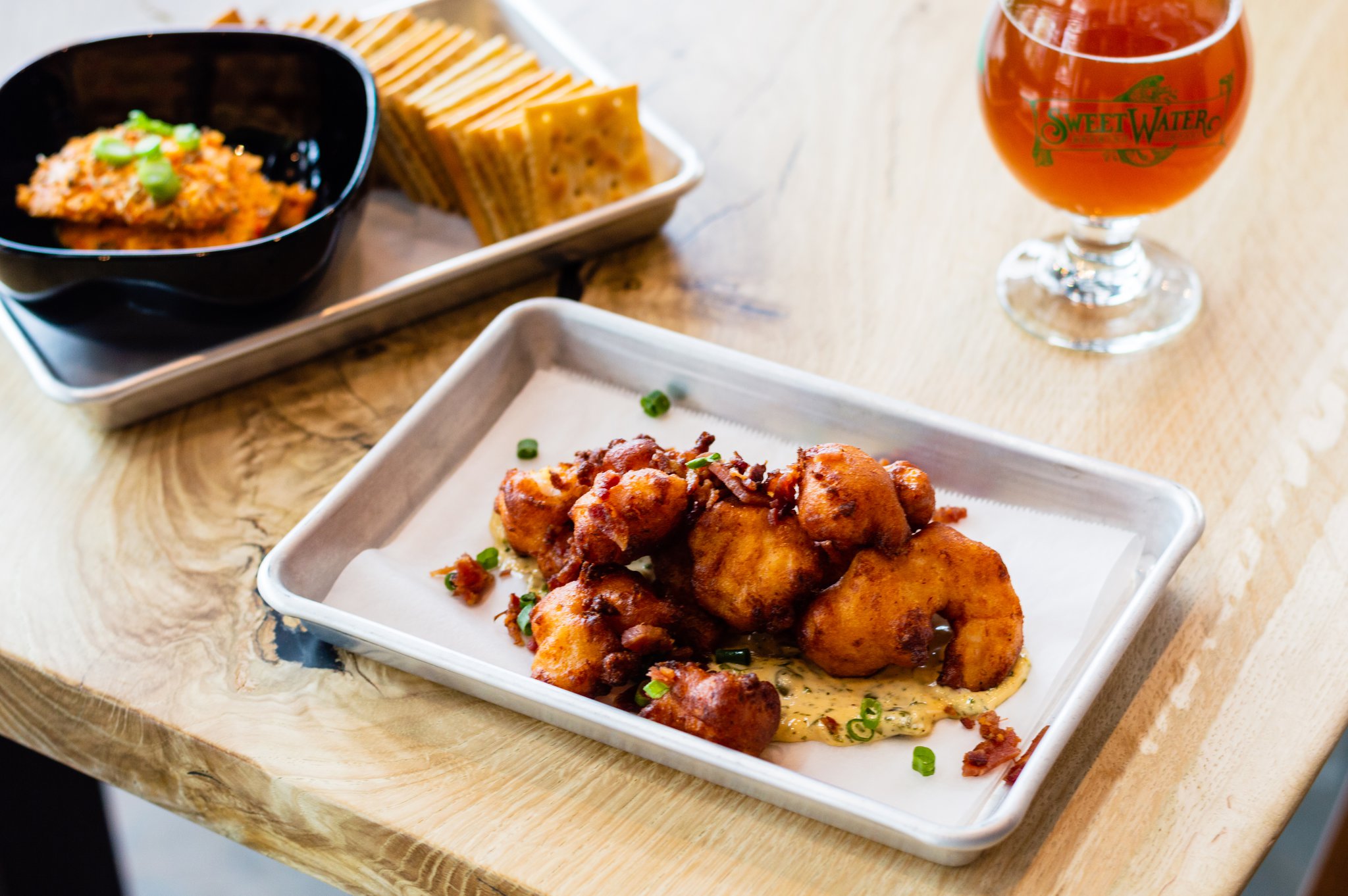 Gulf shrimp hush puppies with Tabasco tartar sauce, bacon and green onions. CONTRIBUTED BY HENRI HOLLIS