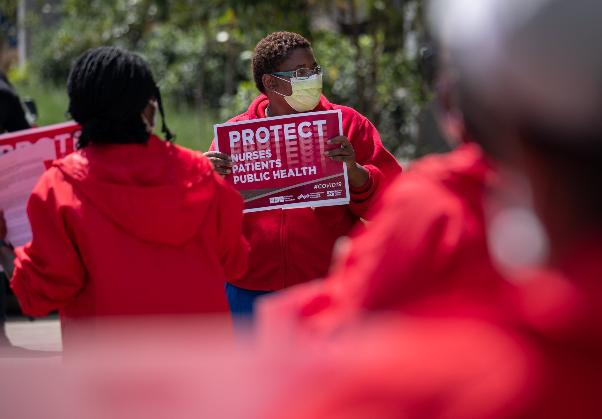 Dana Horton, a radiology registered nurse at the Atlanta VA Medical Center and the local union director for National Nurses United, is seen here protesting inadequate personal protective equipment outside the VA in April. Horton says that with COVID-19 cases ticking back up, workers are nervous again about the PPE supply. (Ben@BenGray.com for the Atlanta Journal-Constitution)