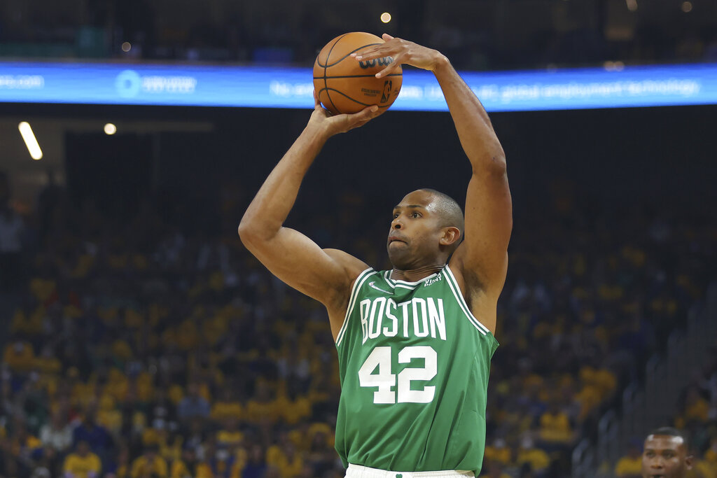 Boston Celtics center Al Horford (42) shoots against the Golden State Warriors during the first half of Game 1 of basketball's NBA Finals in San Francisco, Thursday, June 2, 2022. (AP Photo/Jed Jacobsohn)