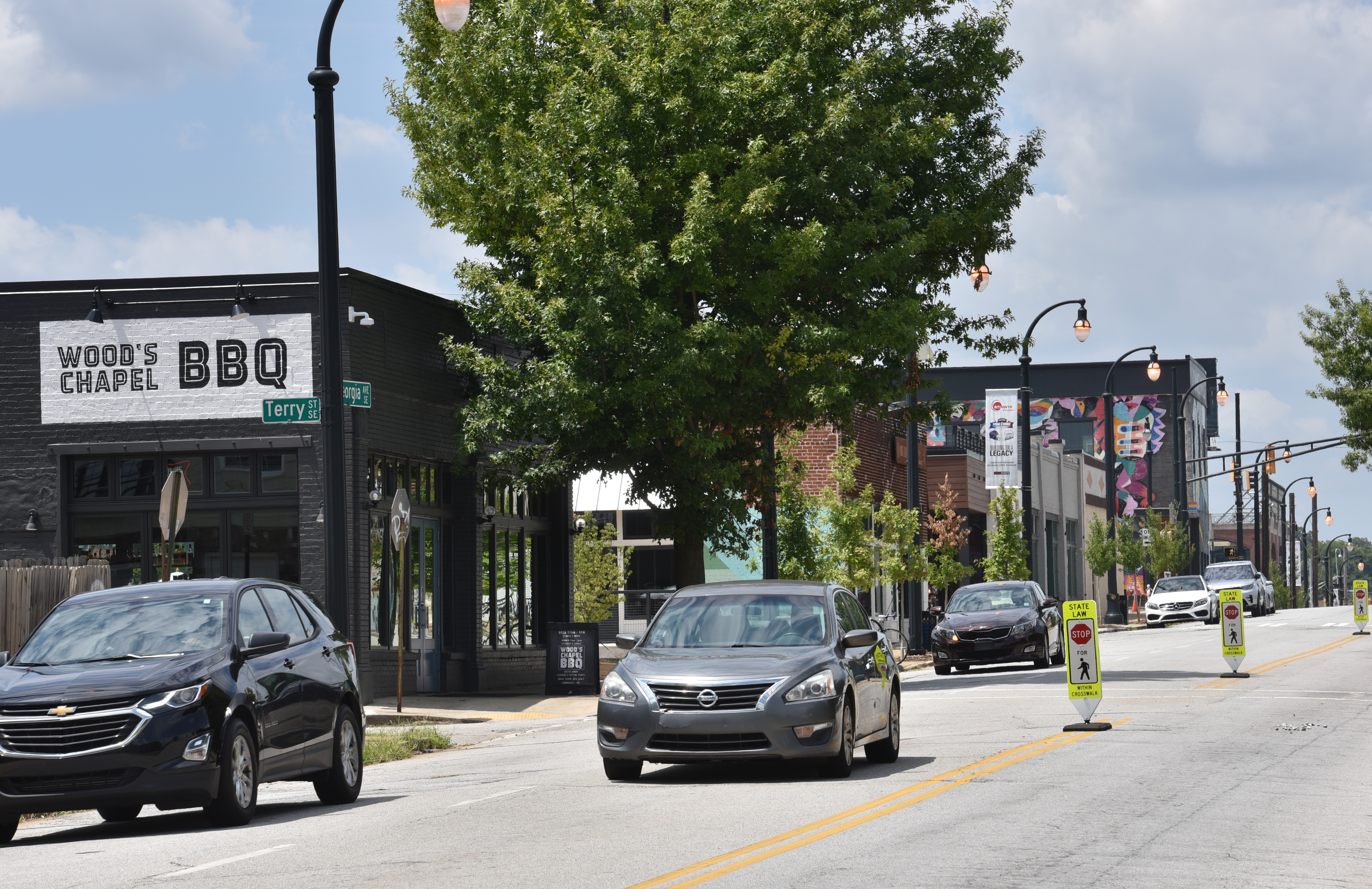 Recently opened shops as a part of a mixed-use project along Georgia Avenue, a couple of blocks east of Georgia State Stadium in Atlanta on Wednesday, August 14, 2019.