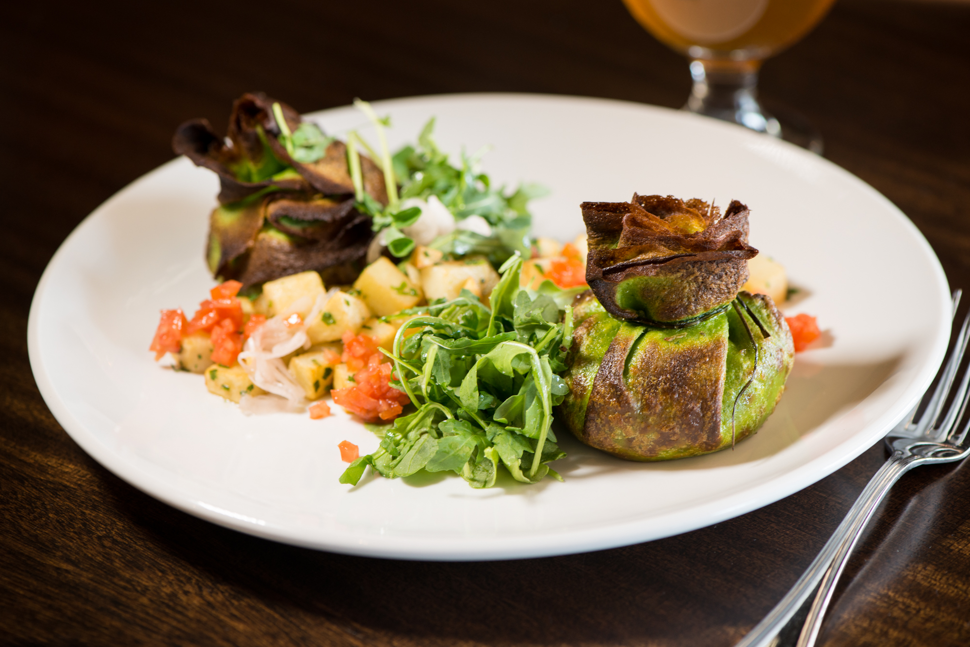 From the Earth Baby Spinach Beggar's Purse with mushrooms, goat cheese, walnut, spinach, heirloom carrots, brussels sprouts, herbed potato, and pickled shallot. Photo credit- Mia Yakel.