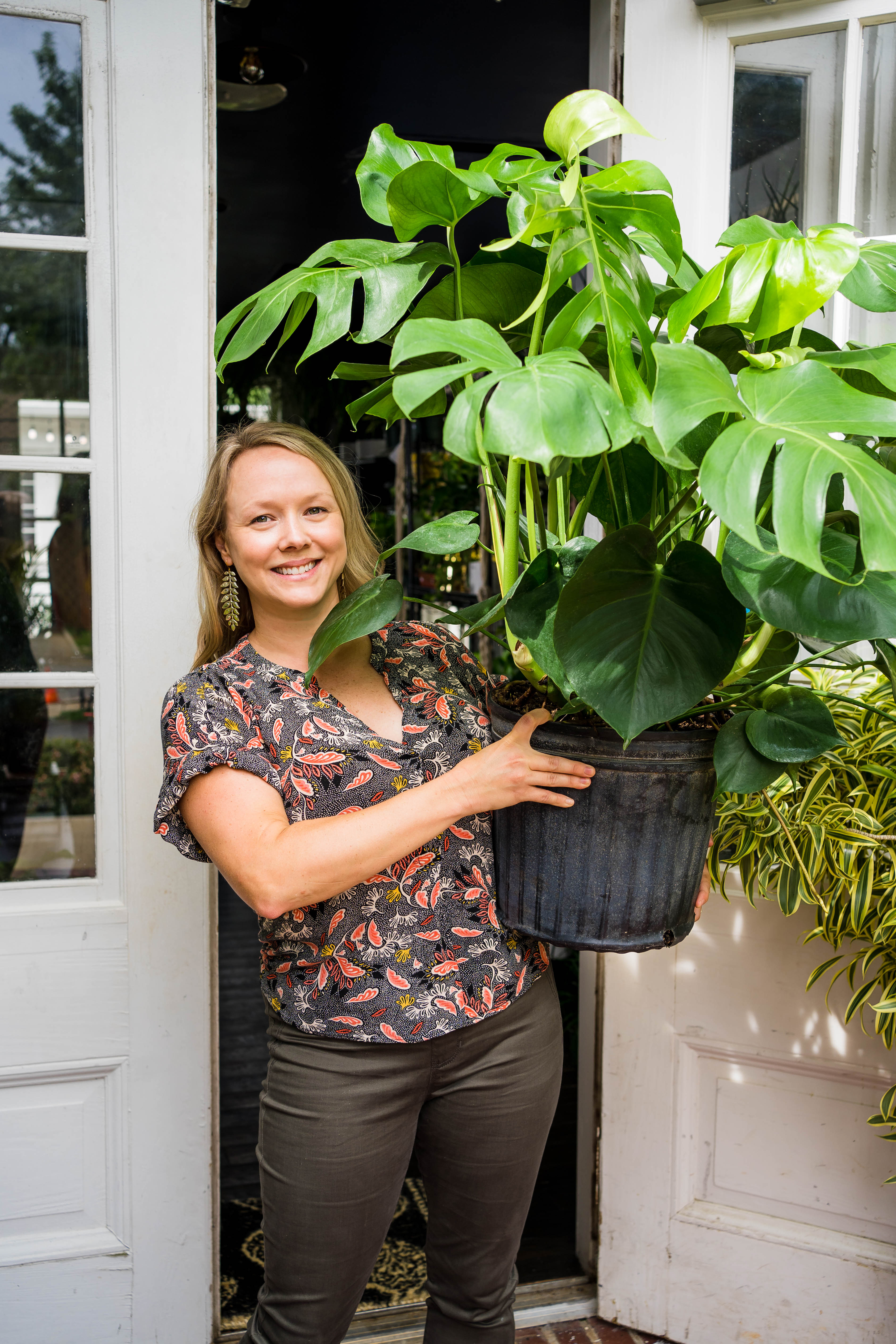 Andrea Kidd holds a monstera deliciosa outside of Lush Plant Co.’s opening night of its Decatur store in 2021.
Courtesy of Lush Plant Co.