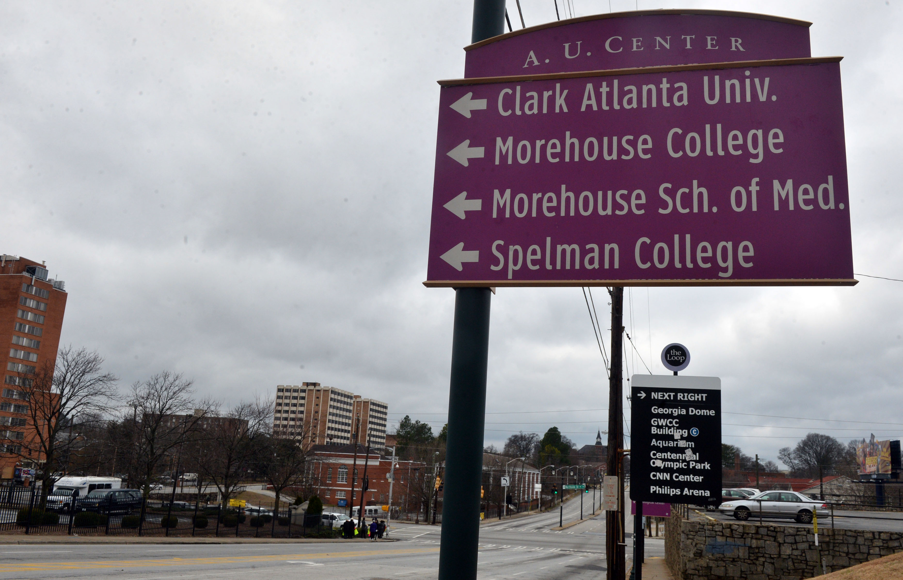 Signs point to the Atlanta University Center area along Martin Luther King Jr Drive before Northside Drive.