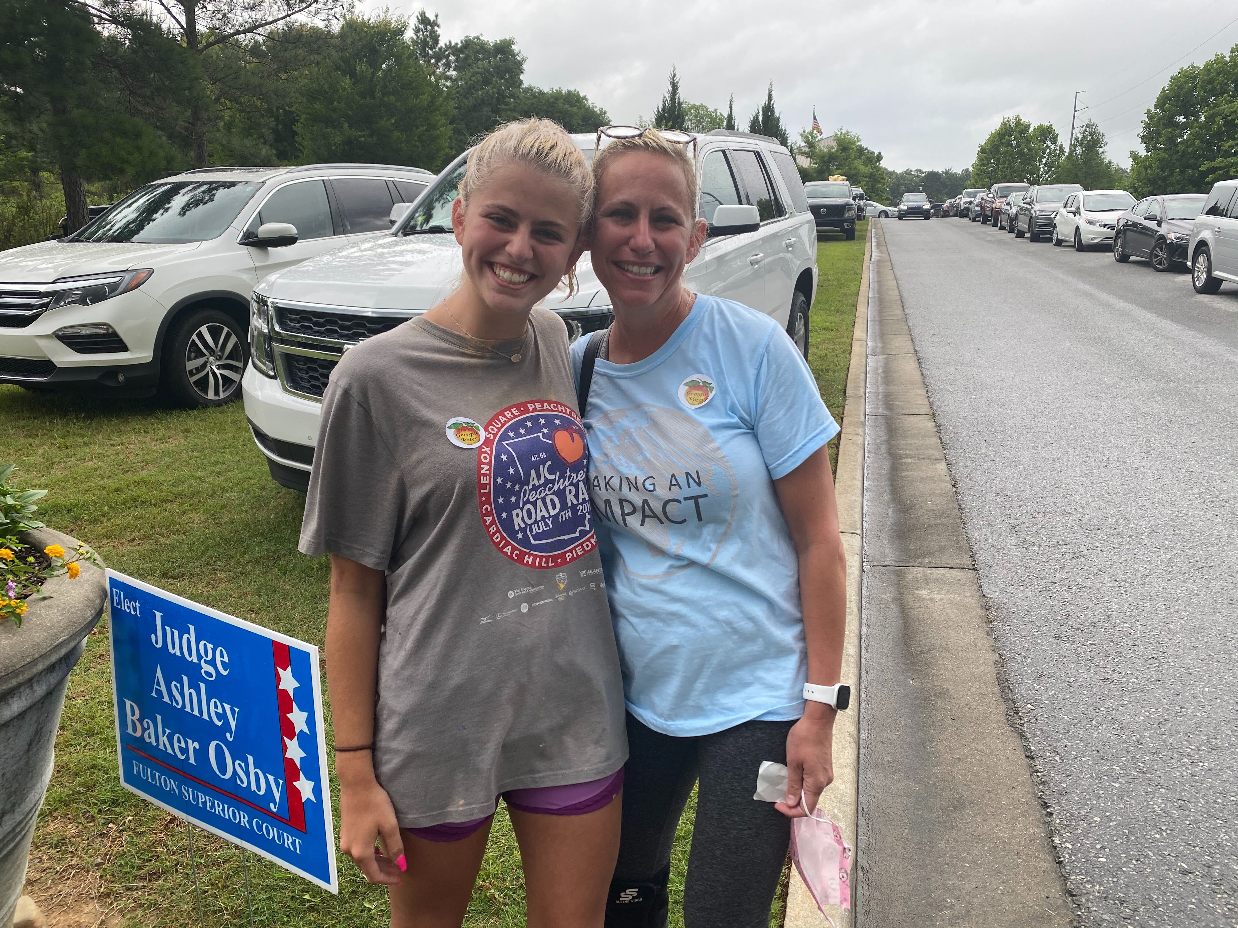 Mother and daughter, Carleigh Hyser and Kristin Gotham after voting at the Johns Creek Environmental Campus. (ADRIANNE MURCHISON/AJC)