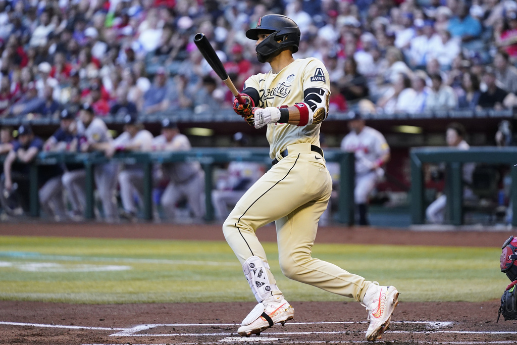 Atlanta Braves' Eddie Rosario, right, celebrates his home run against the  Arizona Diamondbacks with third base coach Ron Washington during the  seventh inning of a baseball game Friday, June 2, 2023, in