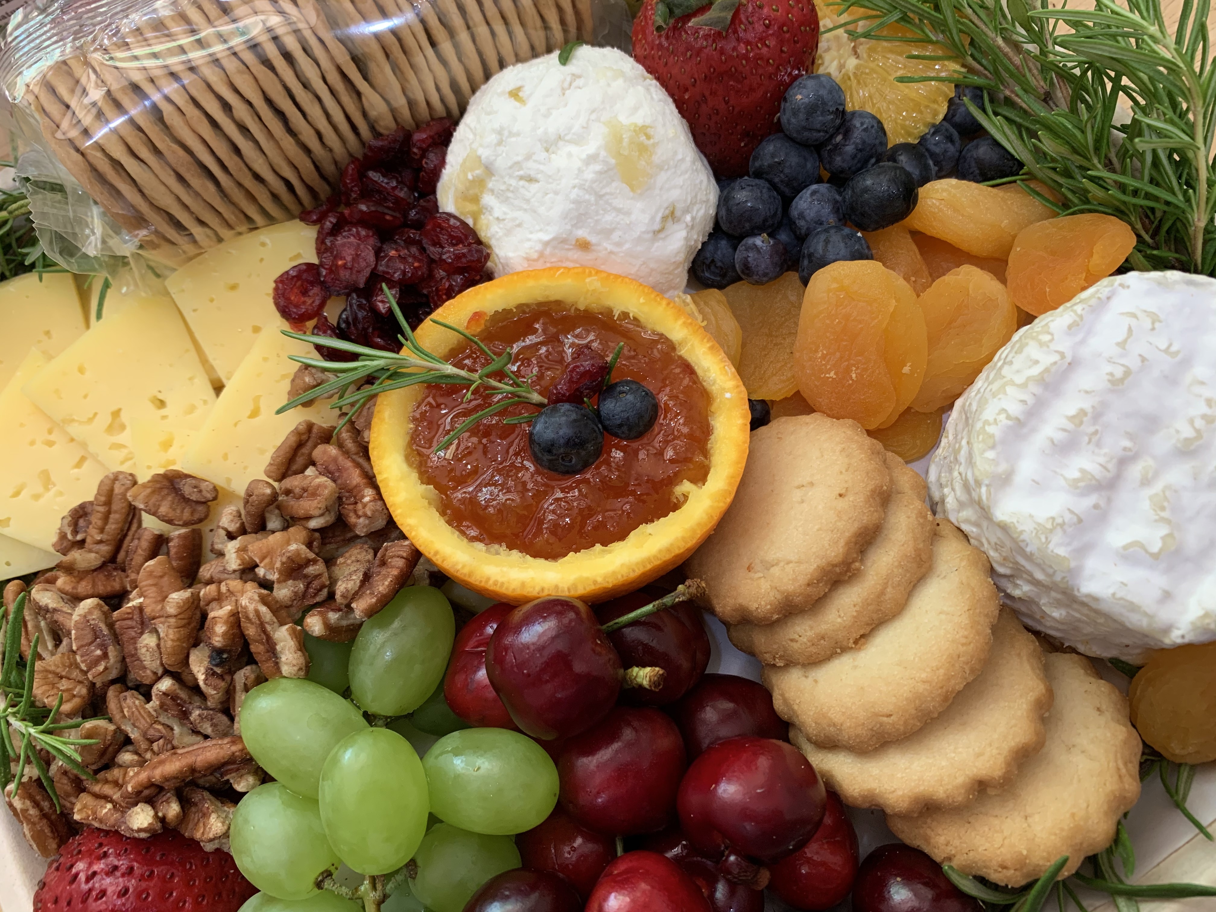 This cheese board includes two cow’s milk cheeses — Concord tomme and WayPoint — along with a crottin of fresh pear and cardamom chevre. Courtesy of CalyRoad
