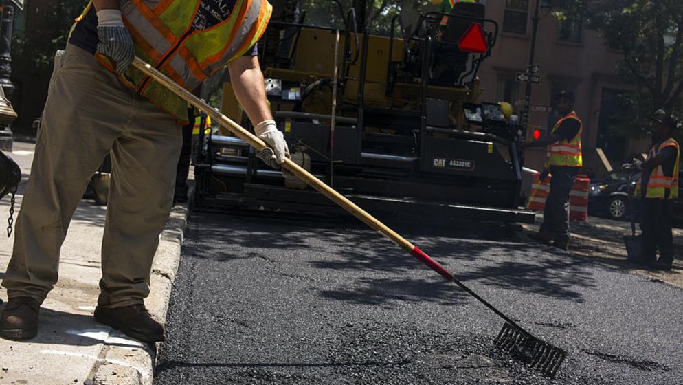 DeKalb County contractors deploy crews to fix roads through the SPLOST paving program. AJC file photo