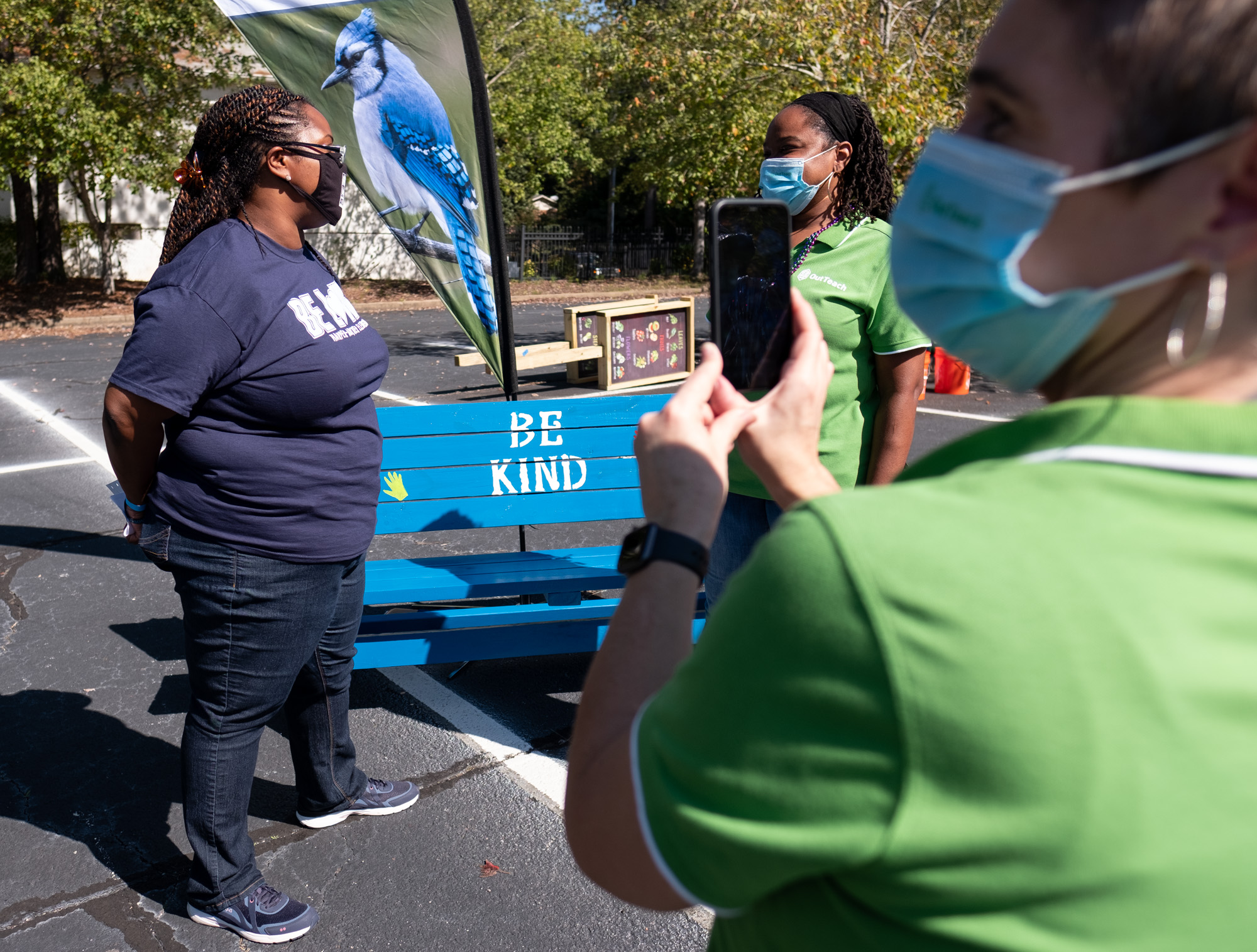 Dione Simon Taylor, principal of Harper-Archer Elementary School in Atlanta, left, is interviewed by Katrina Reed, school partnerships manager with Out Teach, on Oct. 13, 2020, for a Facebook Live post during an event where volunteers dropped off projects they built for an outdoor learning lab at the school. (Ben Gray for the Atlanta Journal-Constitution)