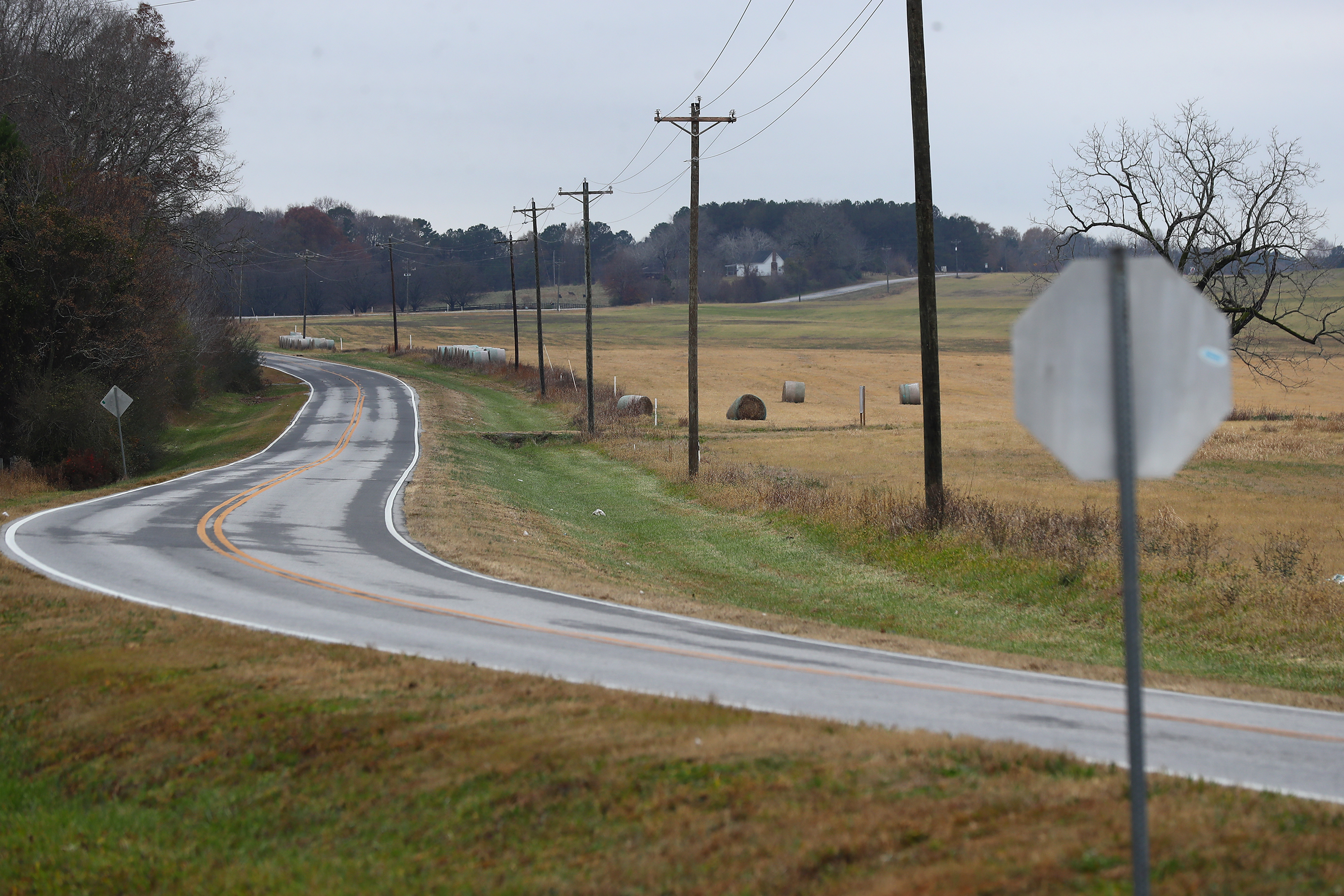 Pasture land sits on either side of Davis Academy Road where it runs through the planned Rivian electric vehicle plant site on Wednesday, Dec 8, 2021, near Rutledge, Georgia. “Curtis Compton / Curtis.Compton@ajc.com”`