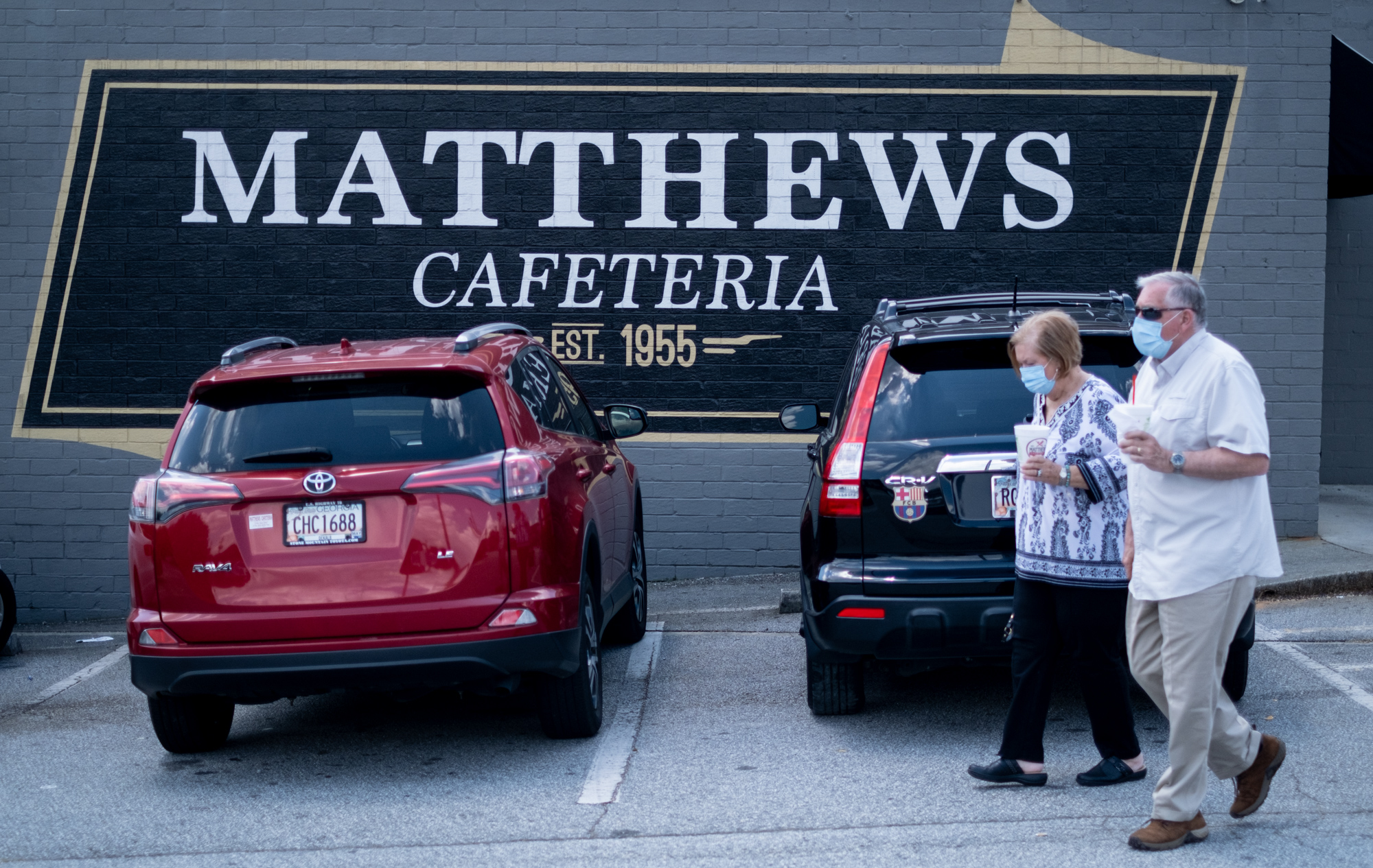 200717-Tucker-Customers leave Matthews Cafeteria on Main Street in Tucker on Friday afternoon July 17, 2020. The dining institution, established in 1955, ask customers to wear masks, added the acrylic dividers, made separate entrance and exit doors and have drive-up service. Ben Gray for the Atlanta Journal-Constitution