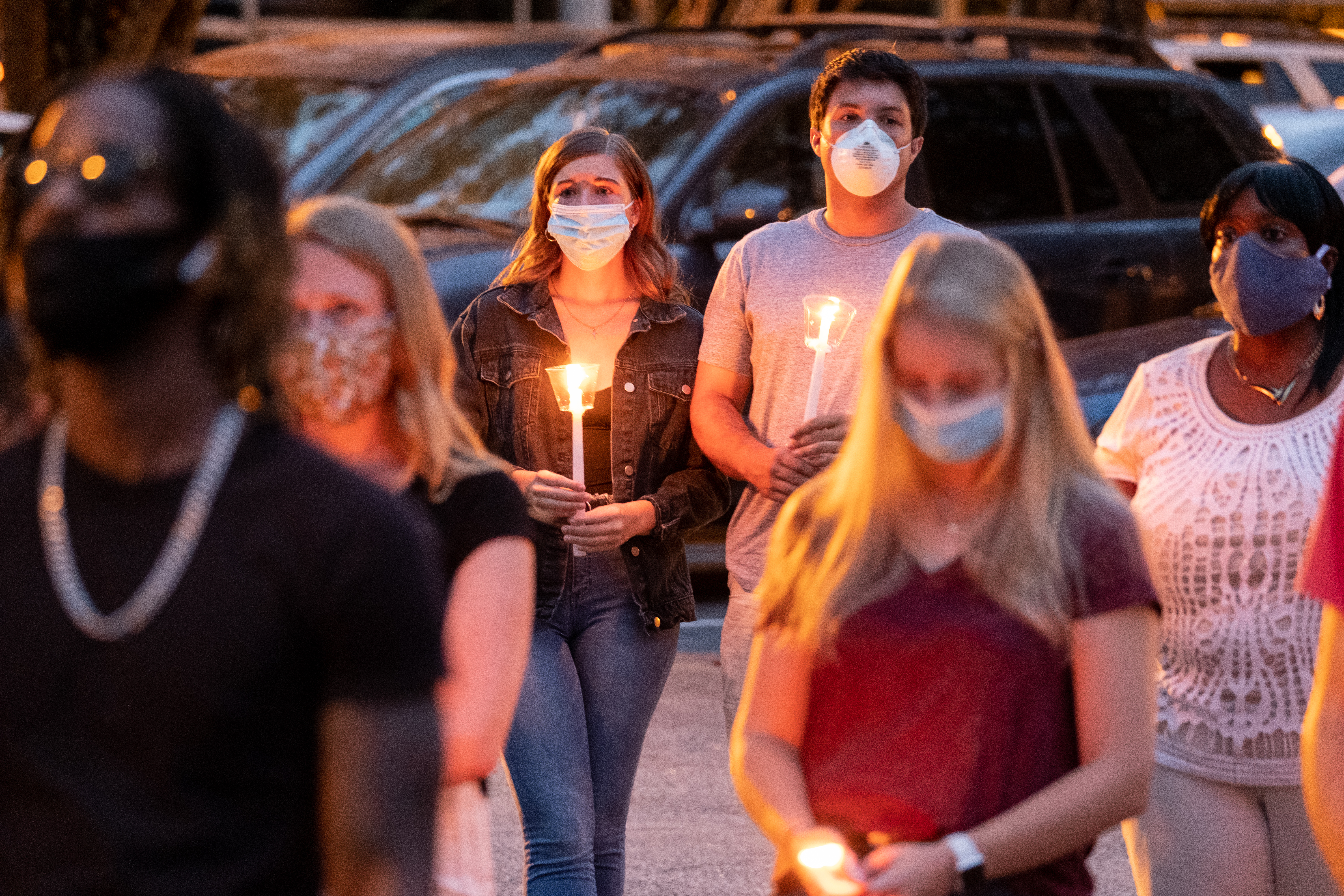 Abby Self, left, and Dakota Palmisano attend a memorial service for Kyle Gregory at Brookwood High School on Friday evening July 24, 2020. (Ben Gray for the Atlanta Journal-Constitution)