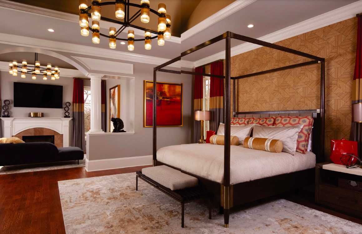 Atlanta sisters and design partners Barbara Elliot and Jennifer Ward-Woods chose a warm palette of gold, gray and red to create a modern and masculine principle bedroom.