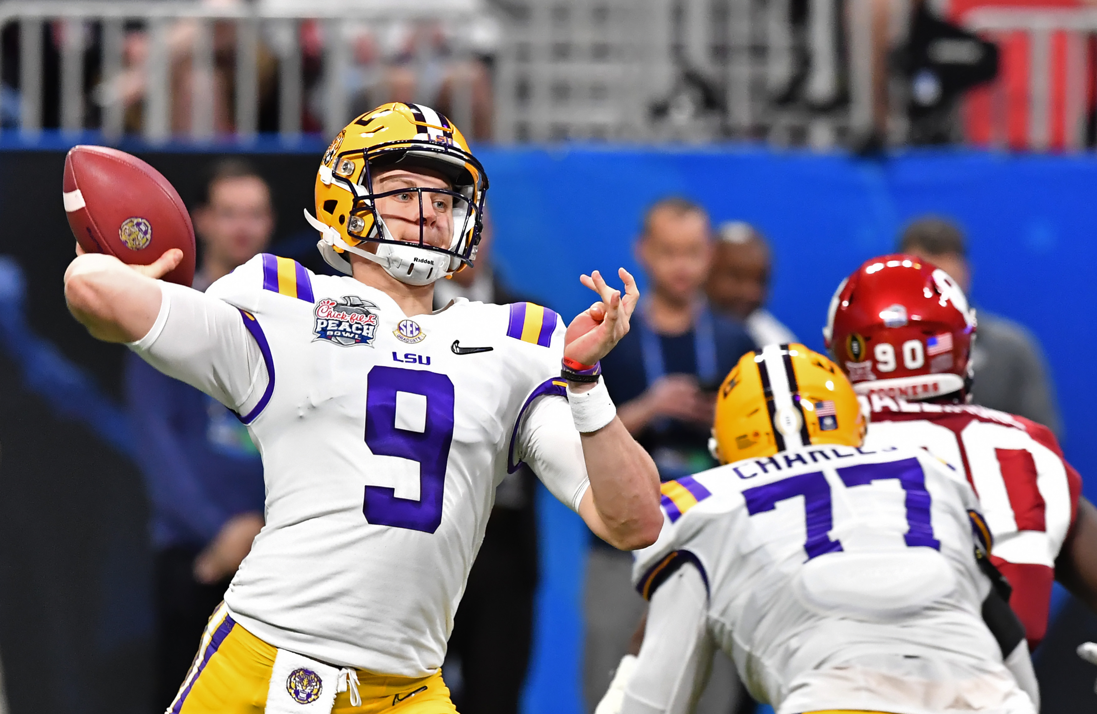 December 28, 2019: LSU's Joe Burrow (9) delivers a pass during the  Chick-Fil-A Peach Bowl - a College Football Playoff Nationall Semifinal -  featuring the Oklahoma Sooners and the LSU Tigers, played