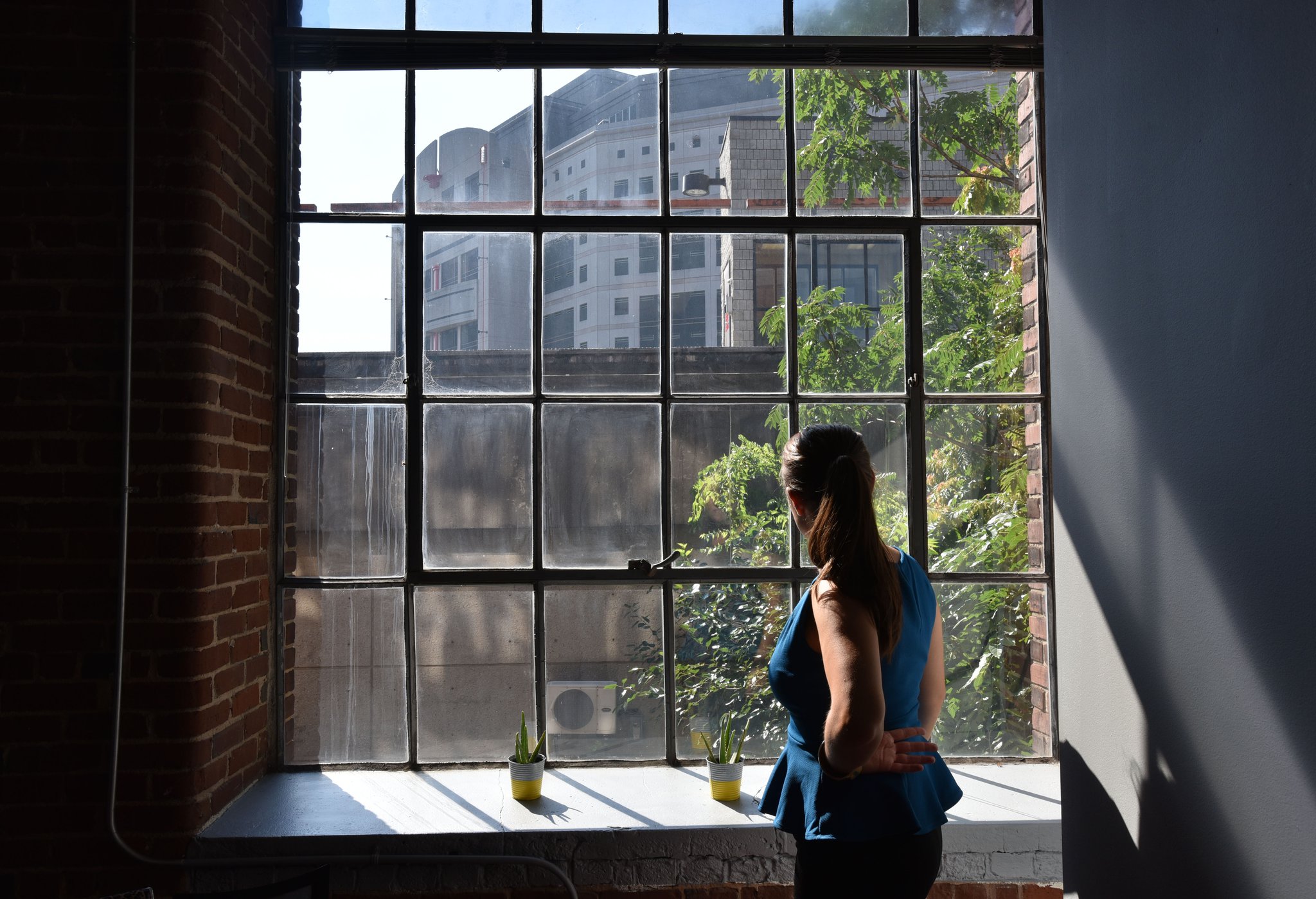 In this 2017 AJC file photo, Police Alternatives and Diversion Executive Director Moki Macias looks out on the Atlanta City Detention Center from her offices. PAD provides services and resources to people who might otherwise be arrested on non-violent charges, and trains police officers to divert some arrests. HYOSUB SHIN / HSHIN@AJC.COM