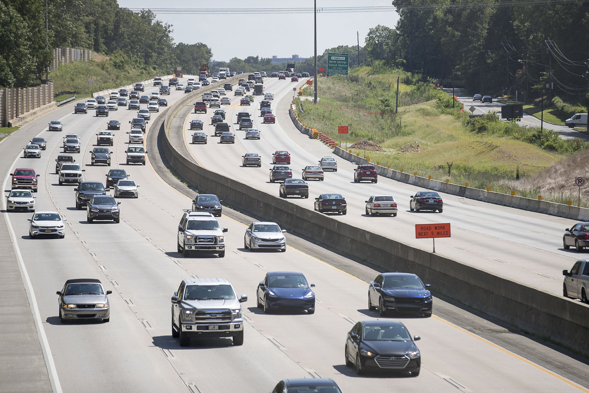 Automobiles travel along Georgia 400, Wednesday, July 24, 2019. Cities along Ga. 400 are talking about petitioning the Georgia Department of Transporation to have a say in how the new highway is being designed as part of the ongoing project. (Alyssa Pointer/alyssa.pointer@ajc.com)