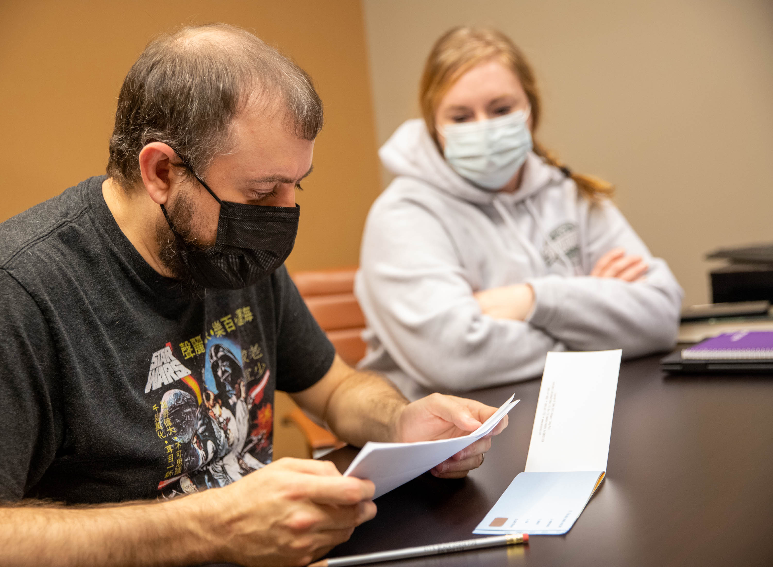 Koie Smith, left, and his wife Jennifer speak to a reporter at AbsoluteCare on Peachtree Street on Thursday, Oct 21, 2021. Koie, who suffers from long COVID, is tracking more than a dozen symptoms such as sleep, light sensitivity and speech so he can report back to his doctors.(Jenni Girtman for The Atlanta Journal-Constitution