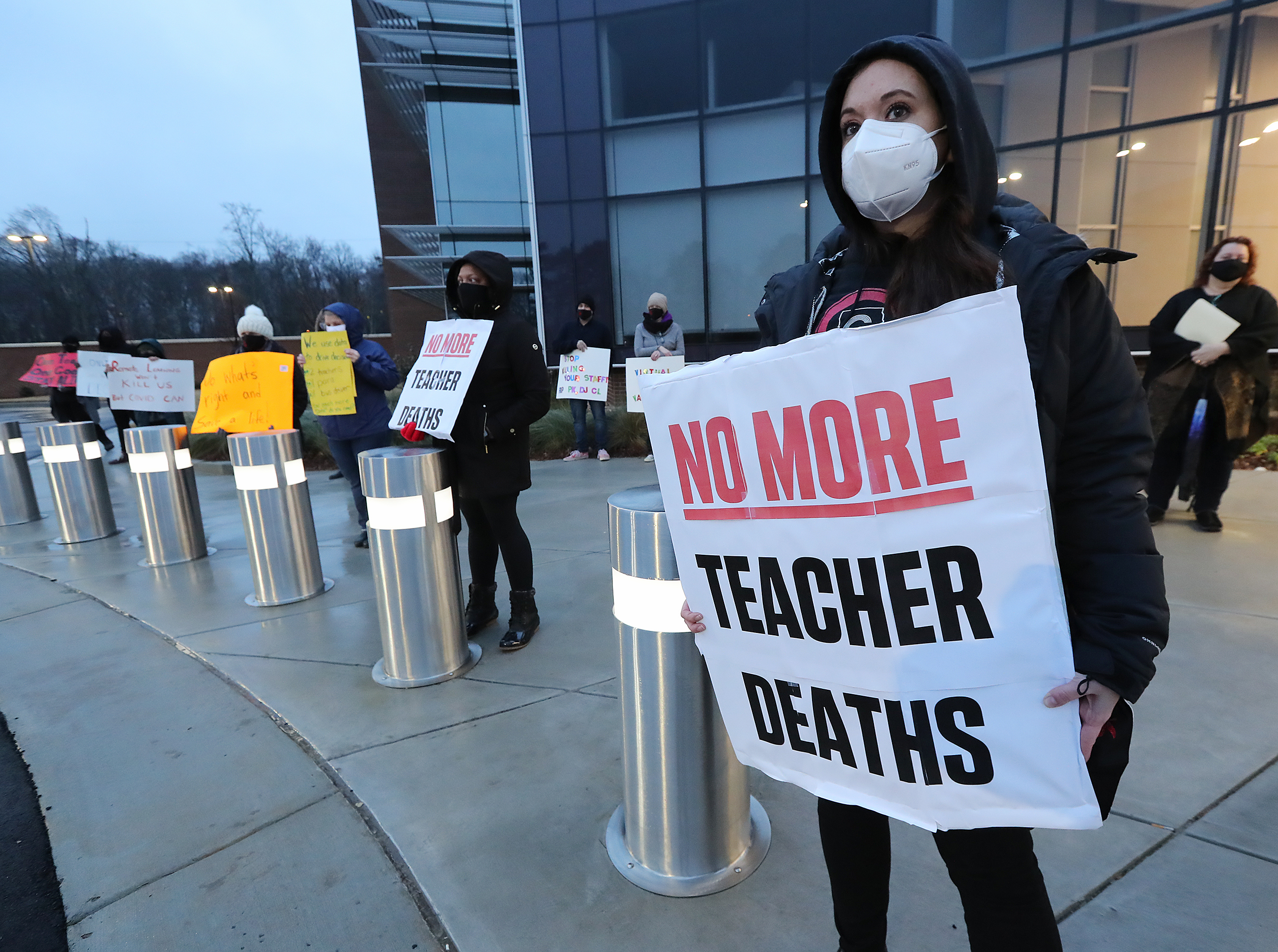 012121 Marietta: School counselor Jennifer Susko (right) is one of hundreds of Cobb County teachers and staff holding a protest in the parking lot during the school board meeting at the Cobb County School District's Offices on Thursday, Jan. 21, 2021, in Marietta. Cobb teachers are pressing the district for improved COVID-19 response. Curtis Compton / Curtis.Compton@ajc.com”