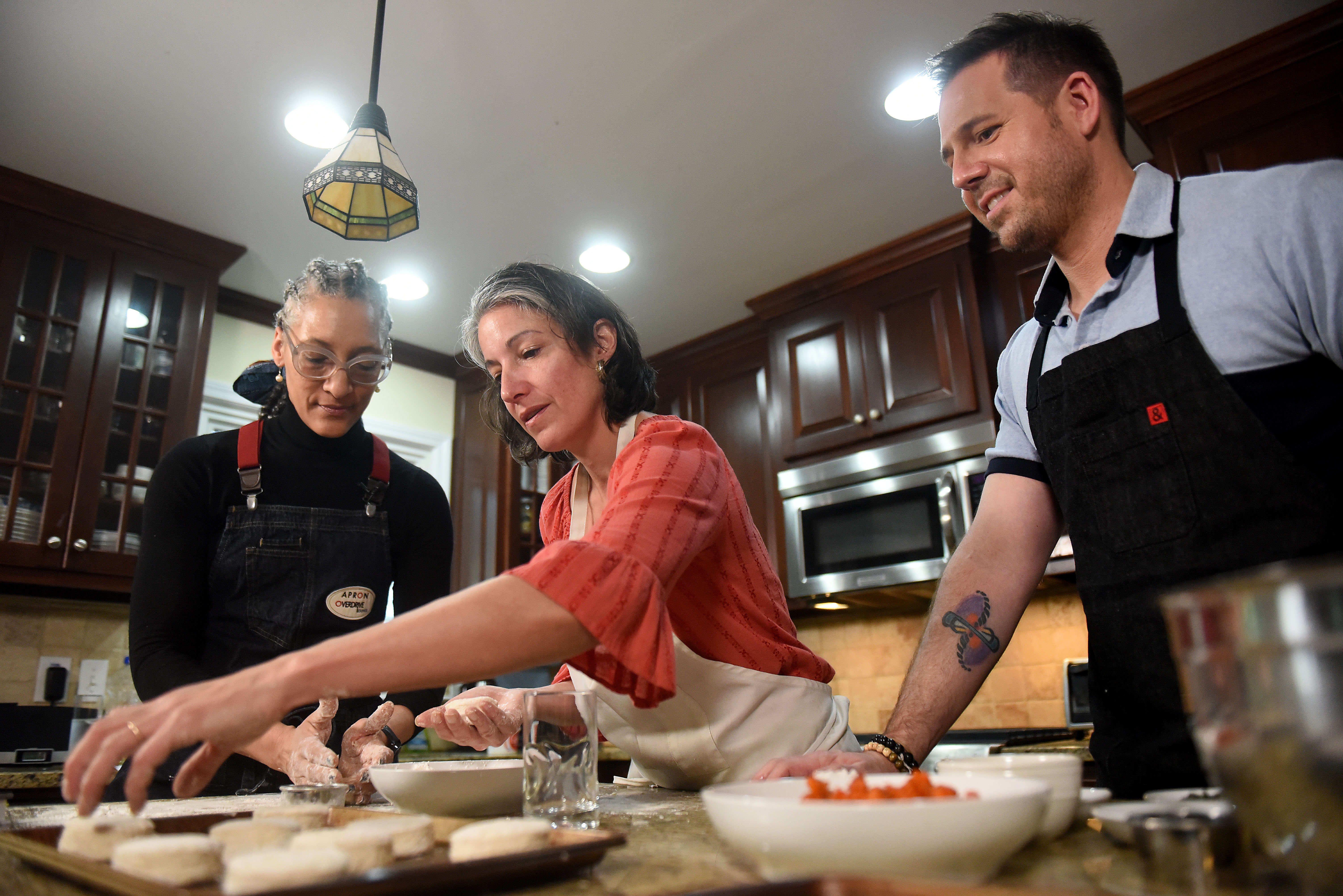 February 22, 2019 Atlanta - The AJCâs Ligaya Figueras (center) hosts food expert Chadwick Boyd (right) and Top Chef Carla (left) Hall at her home, where the two share tips with Ligaya on how to make the best biscuits. RYON HORNE / RHORNE@AJC.COM