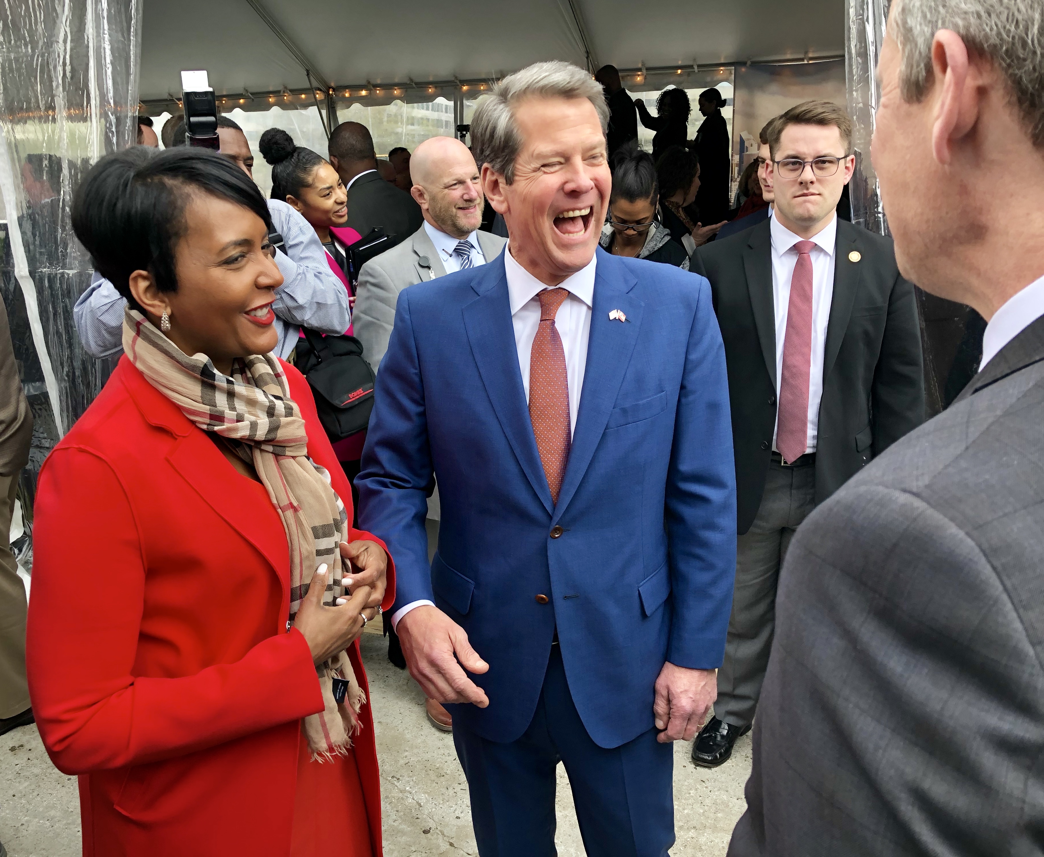 Atlanta Mayor Keisha Lance Bottoms and Gov. Brian Kemp chat before the Norfolk Southern groundbreaking. AJC/Scott Trubey.