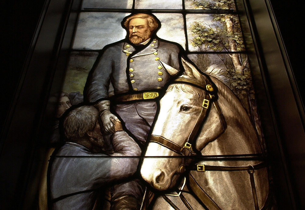 Inside historic Rhodes Hall, a series of stained glass windows tell the story of the “Lost Cause.” The building was once the home of the Georgia Archives. (CHARLOTTE B. TEAGLE / AJC file)