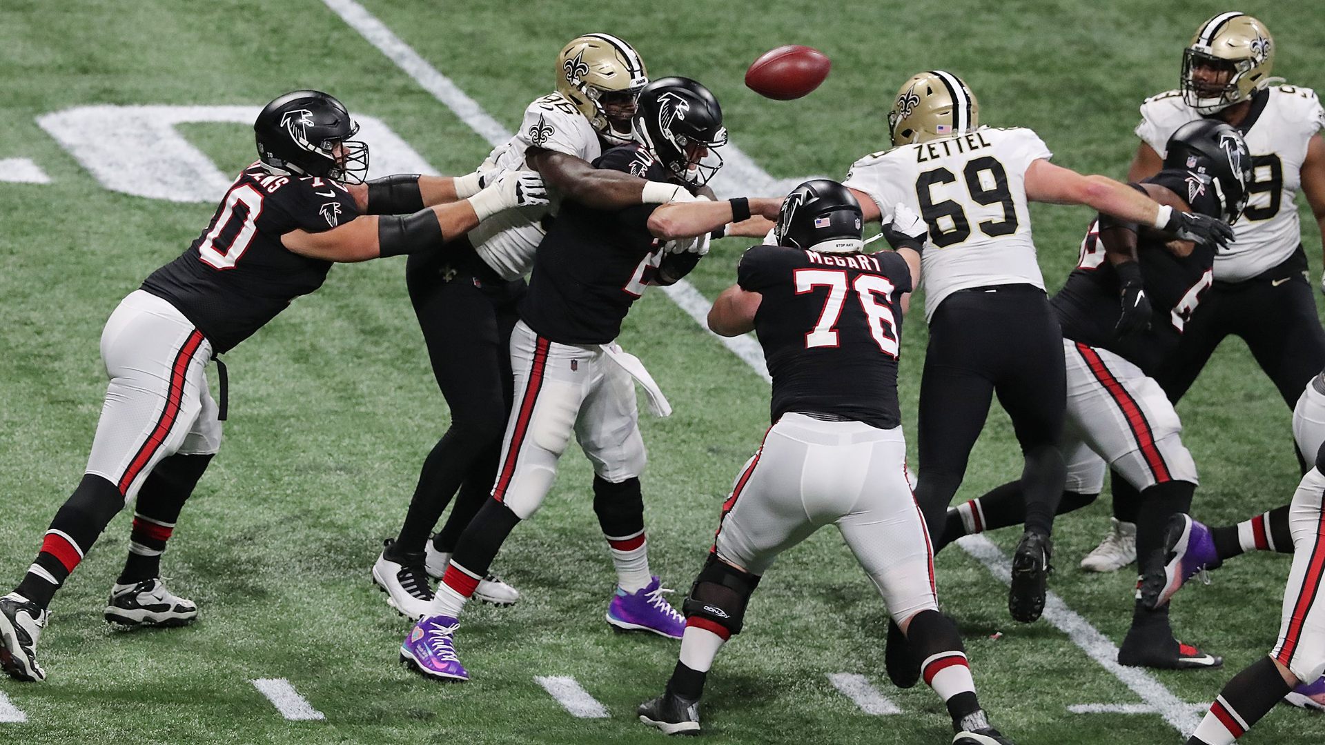 Atlanta Falcons defensive tackle Mike Pennel (98) walks off the