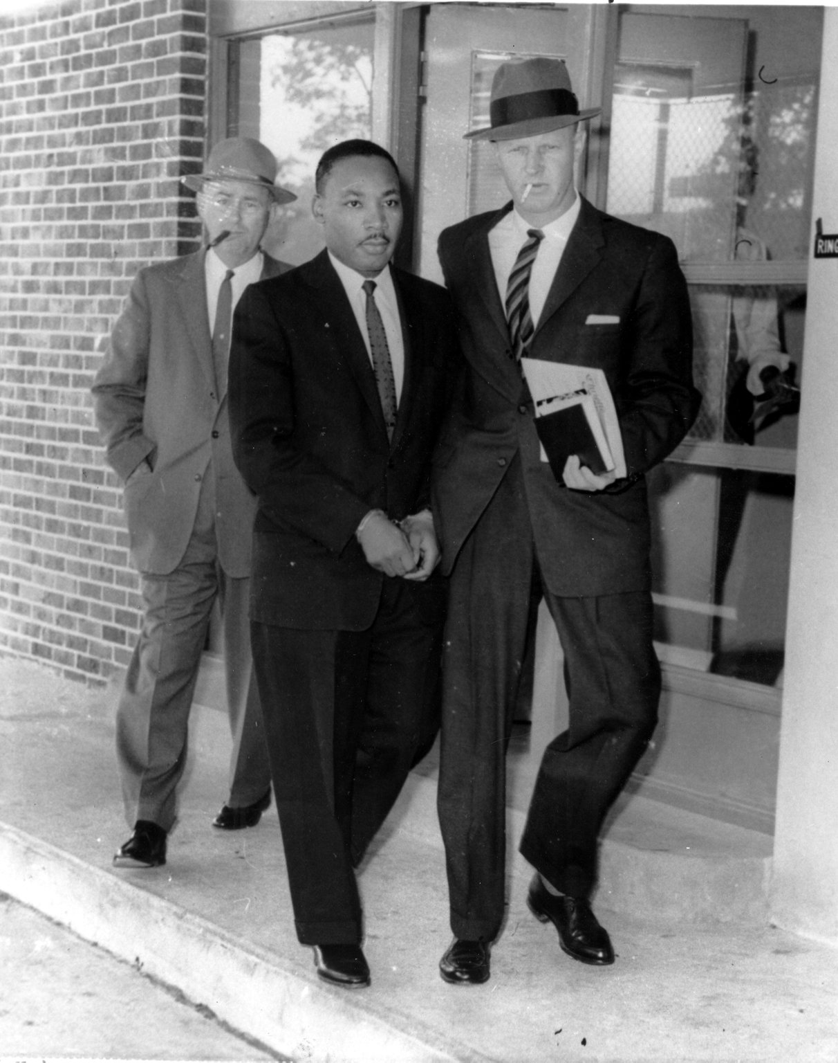 Martin Luther King Jr. is escorted from the Atlanta jail to a DeKalb County courthouse on Oct. 25, 1960. (AP Photo, File)