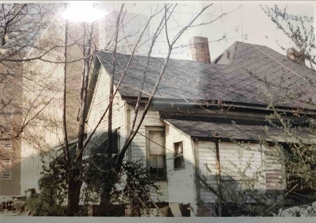 Bobby Crook’s Home: Taken in 1965 in Linnentown during urban renewal. Crook lived at 167 Peabody Street. This photo shows the back of his childhood house in Linnentown with the newly constructed Brumby Hall dormitory for women in the background. Crook’s house was the last house to be demolished. Courtesy of Hargrett Rare Book and Manuscript Library - The University of Georgia Special Collections Libraries