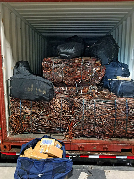 Customs and Border Protection agents discovered 21 duffel bags of cocaine amid scrap aluminum and copper.
