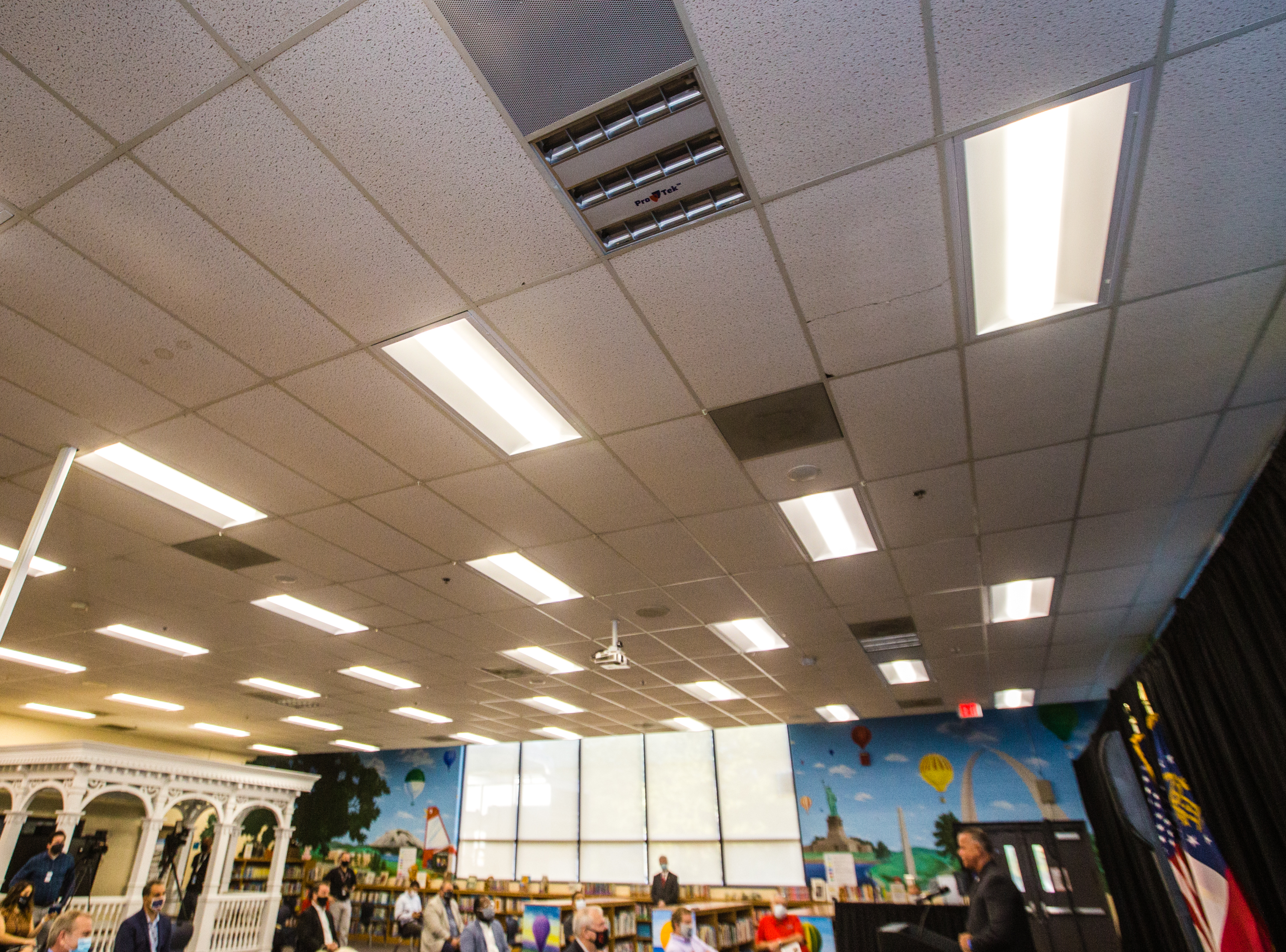 ProTekLife has installed ultraviolet disinfecting panels throughout Bryant Elementary School in Mableton. The technology automatically activates at night, eliminates viruses, bacteria, parasites and infections organisms in the air and on surfaces. The Cobb County School District and the makers of the three sanitation systems installed at the school share information before moving into demonstrates of the technologies Wednesday, Oct 21, 2020. (Jenni Girtman for The Atlanta Journal-Constitution)