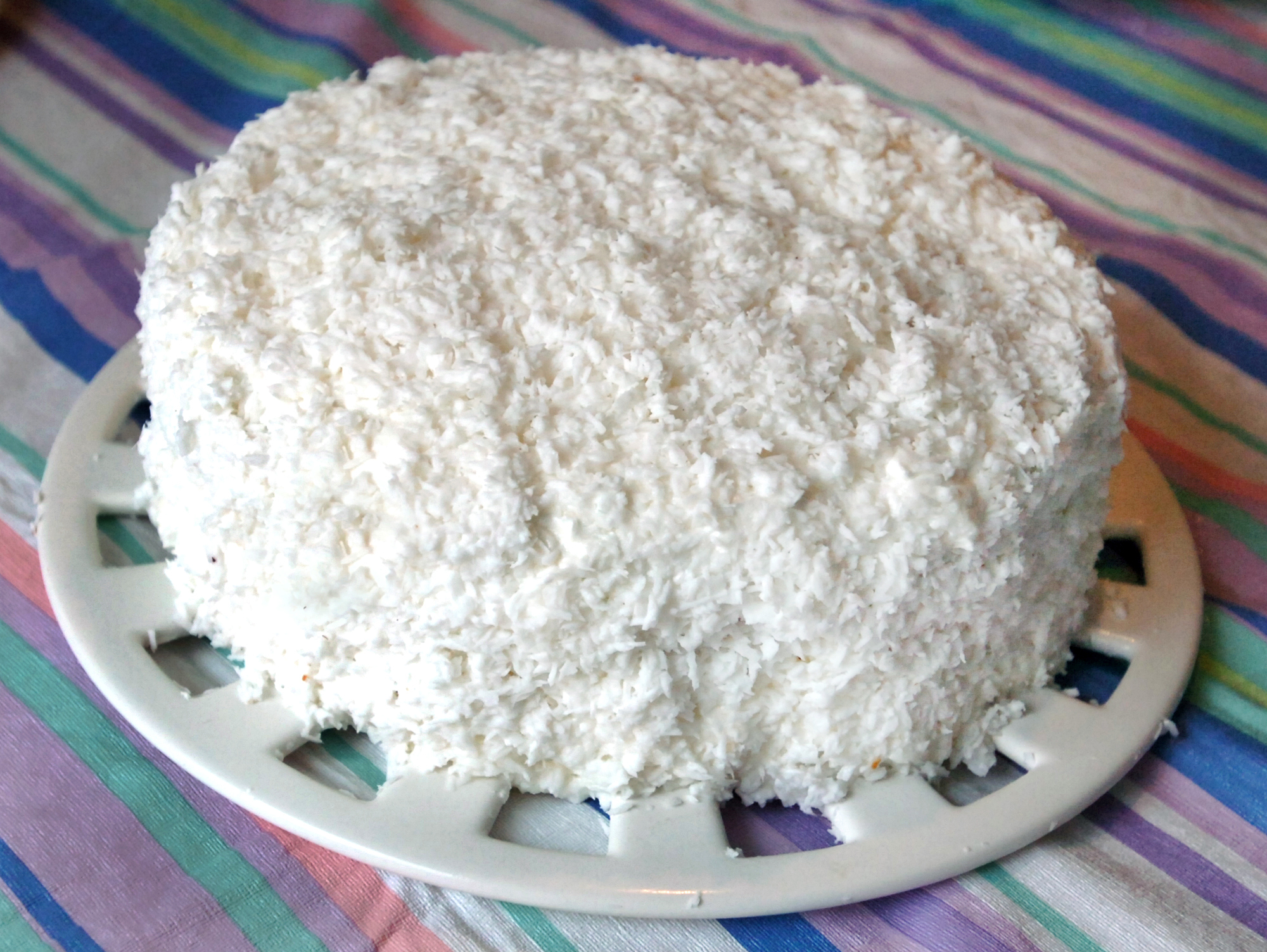 070313 - CONYERS, GA -- The famous Rich's coconut cake, made by Carl Dendy , wih help from local baker Angie Mosier , in Dendy's kitchen at his home in Conyers. Story about one of the most requested recipes in Atlanta, the coconut cake made at the Rich's bakery that closed more than 20 years ago. (CHARLOTTE B. TEAGLE / AJC Staff).