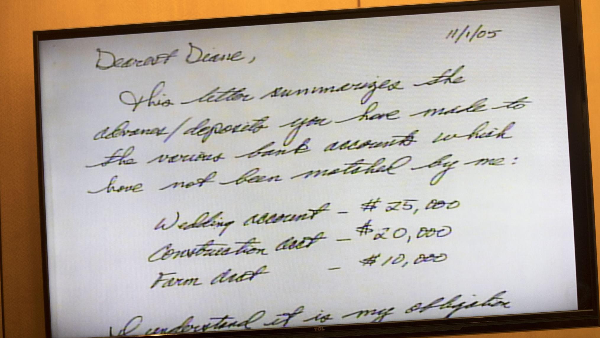03/26/2018 — Atlanta, GA - A note written to Diane McIver from Tex McIver is displayed as evidence. It notes that he needs to repay or match her contributions to several accounts, including one to pay for their wedding. ALYSSA POINTER/ALYSSA.POINTER@AJC.COM