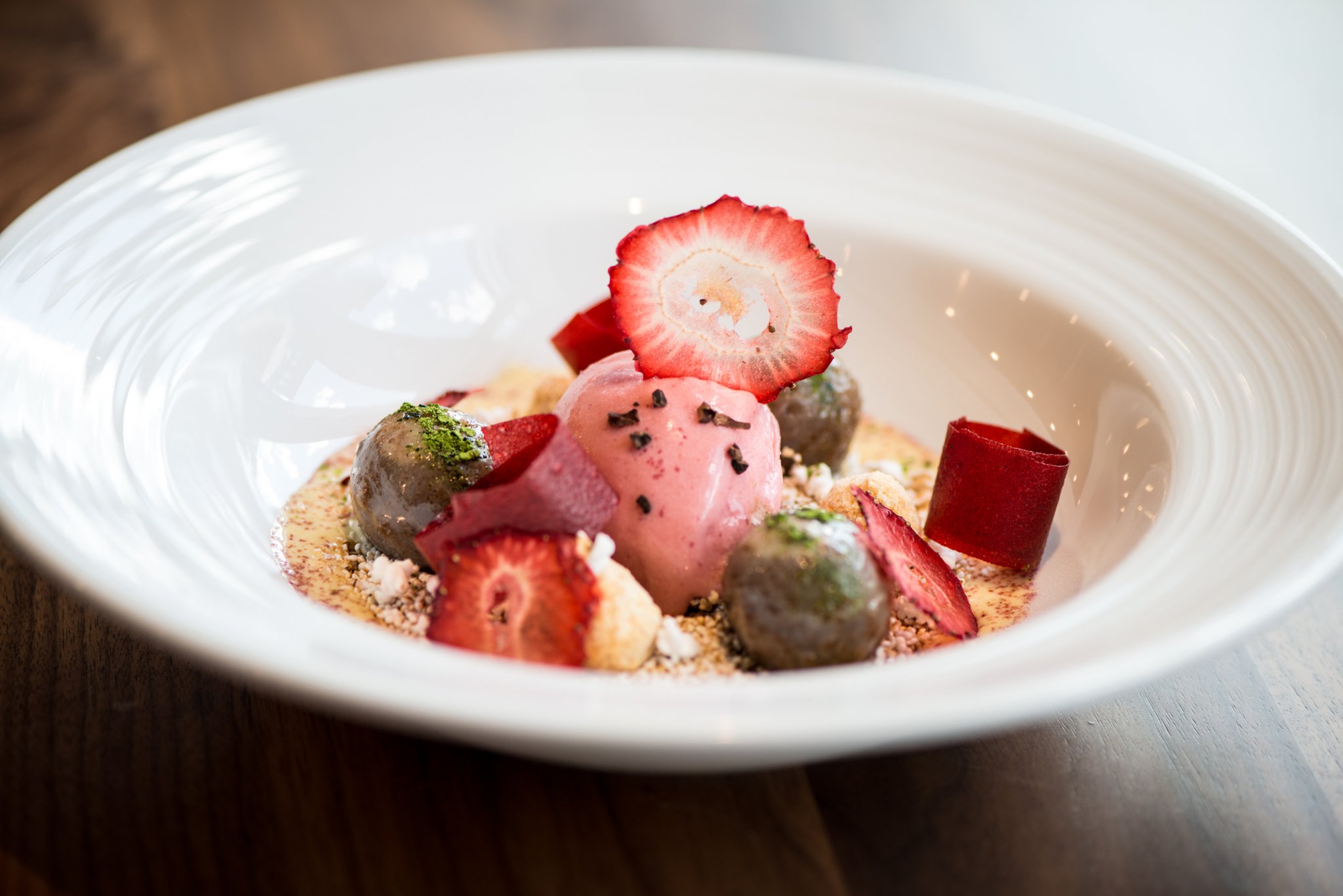 Flourless Chocolate Cake with strawberry gelato and creme anglaise.