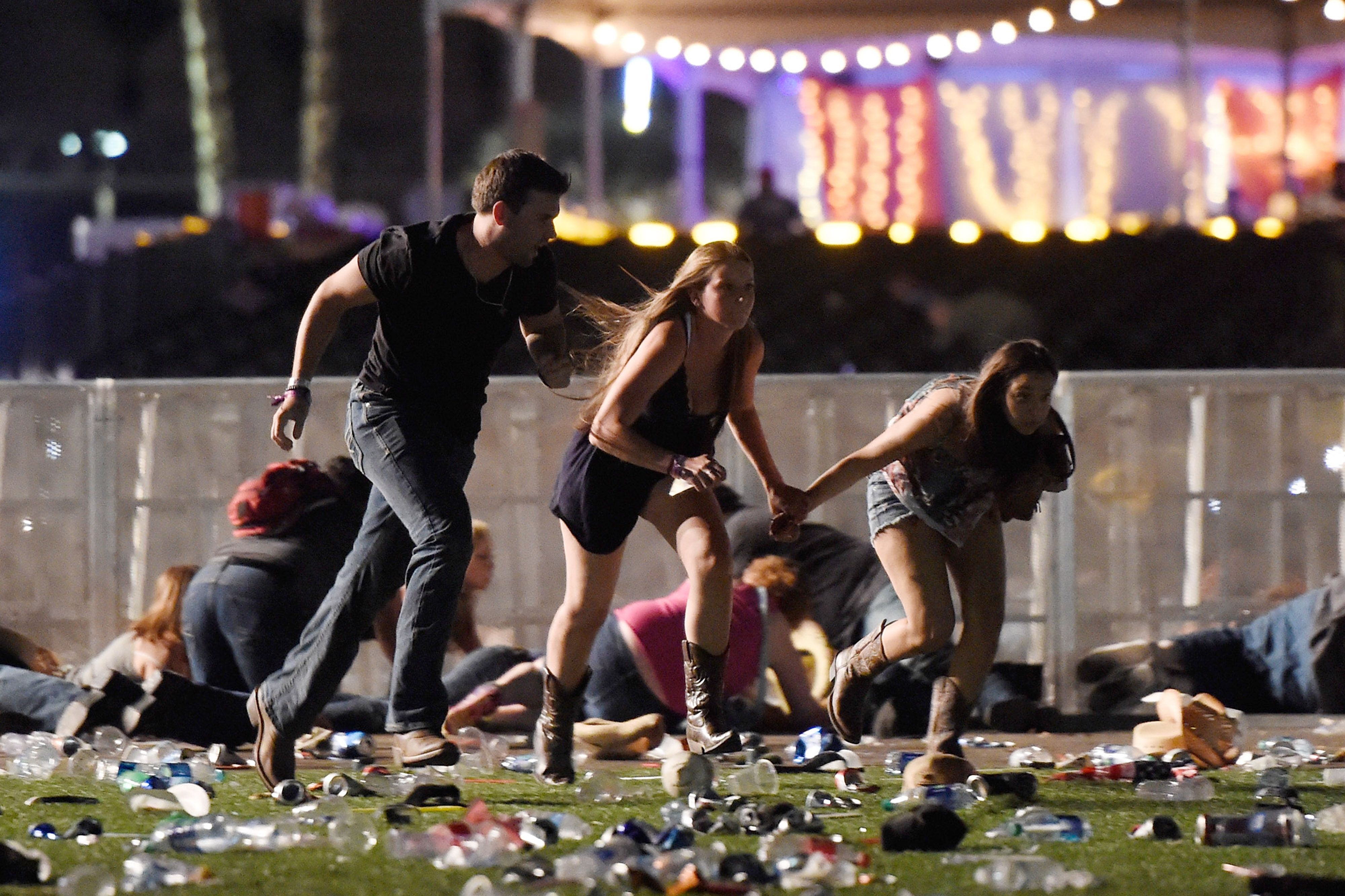 People run from the Route 91 Harvest country music festival amid gunfire on Oct. 1, 2017 in Las Vegas.