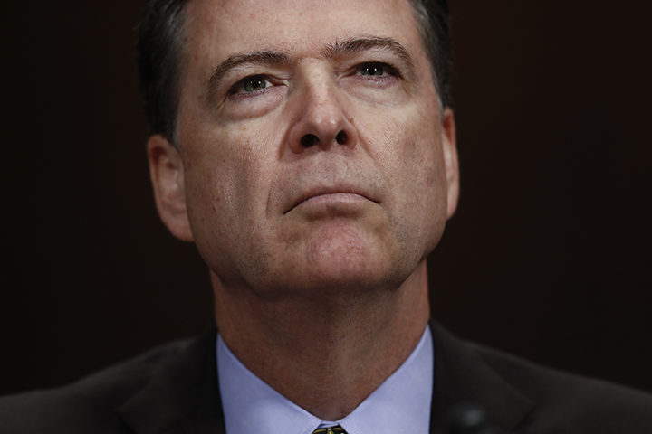 In this Wednesday, May 3, 2017, photo, then-FBI Director James Comey pauses as he testifies on Capitol Hill in Washington, before a Senate Judiciary Committee hearing. President Donald Trump abruptly fired Comey on May 9, ousting the nation's top law enforcement official in the midst of an investigation into whether Trump's campaign had ties to Russia's election meddling.