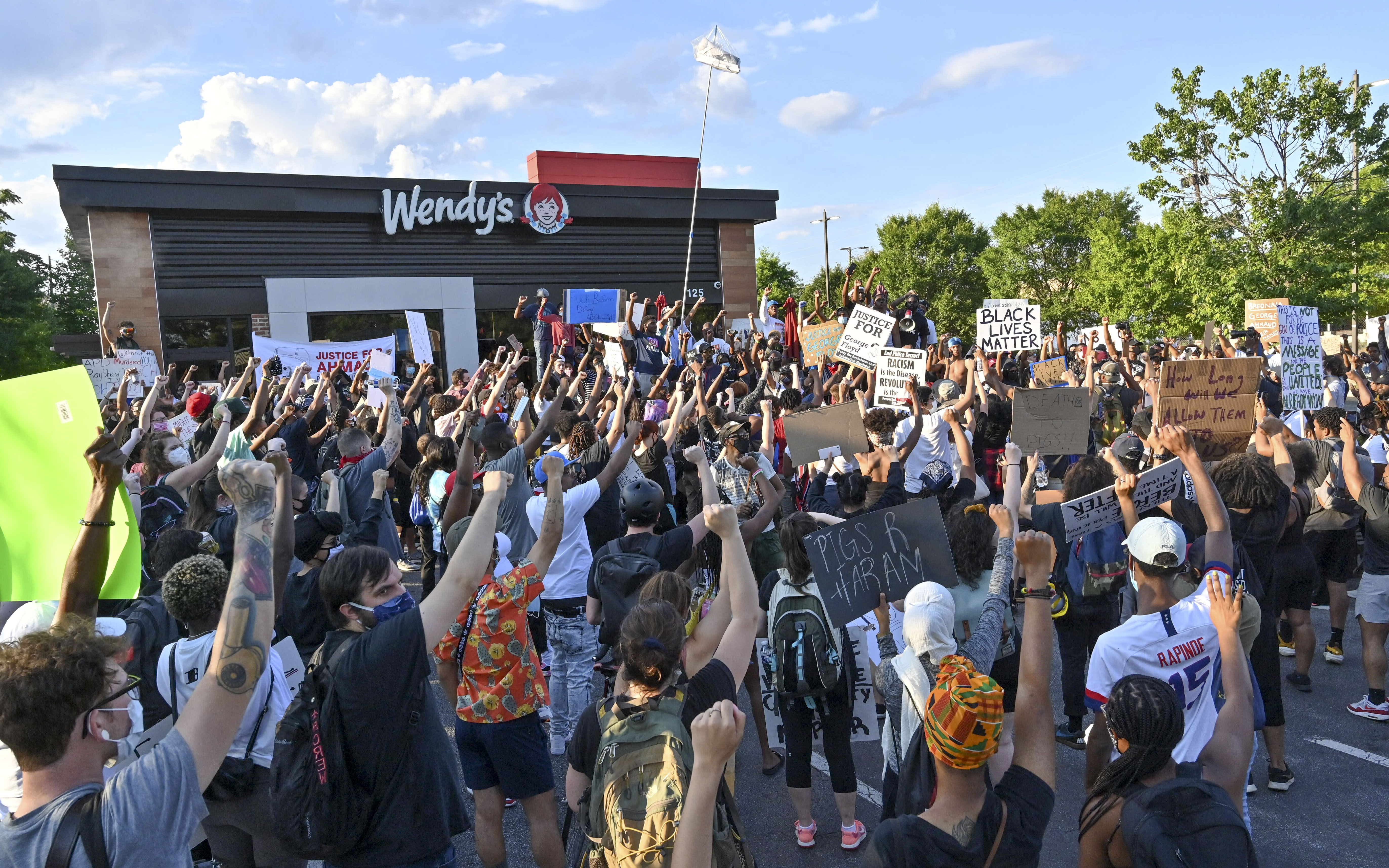 Protesters gather on Saturday, June 13, 2020, at the Atlanta Wendy's where Rayshard Brooks, a 27-year-old black man, was shot and killed by Atlanta police on Friday evening during a struggle in a Wendy's drive-thru line. Hyosub Shin / hyosub.shin@ajc.com