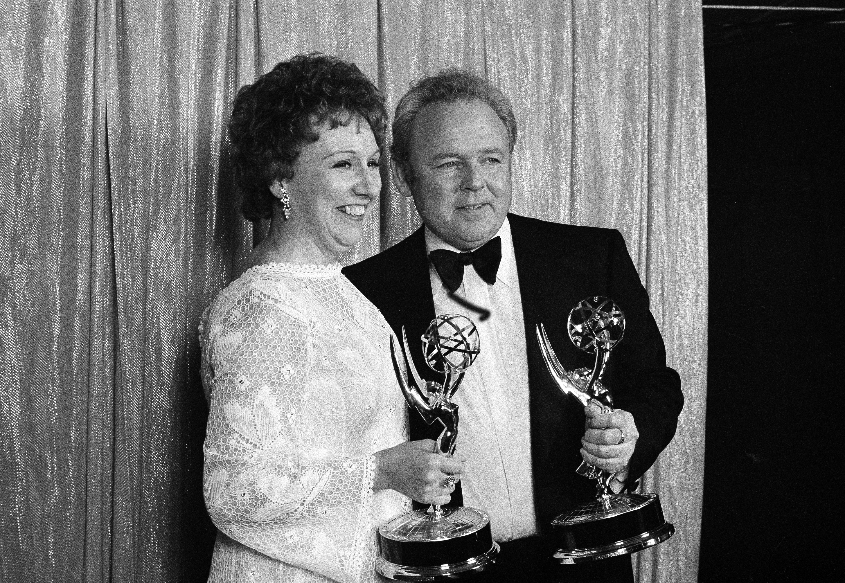 Actors Carroll O'Connor, left, and Jean Stapleton, who co-star in CBS-TV's comedy series "All In The Family" smile as they hold the Emmys they won, May 15, 1972, in Hollywood, for Best Actor and Best Actress in a comedy series. (AP Photo/David F. Smith)