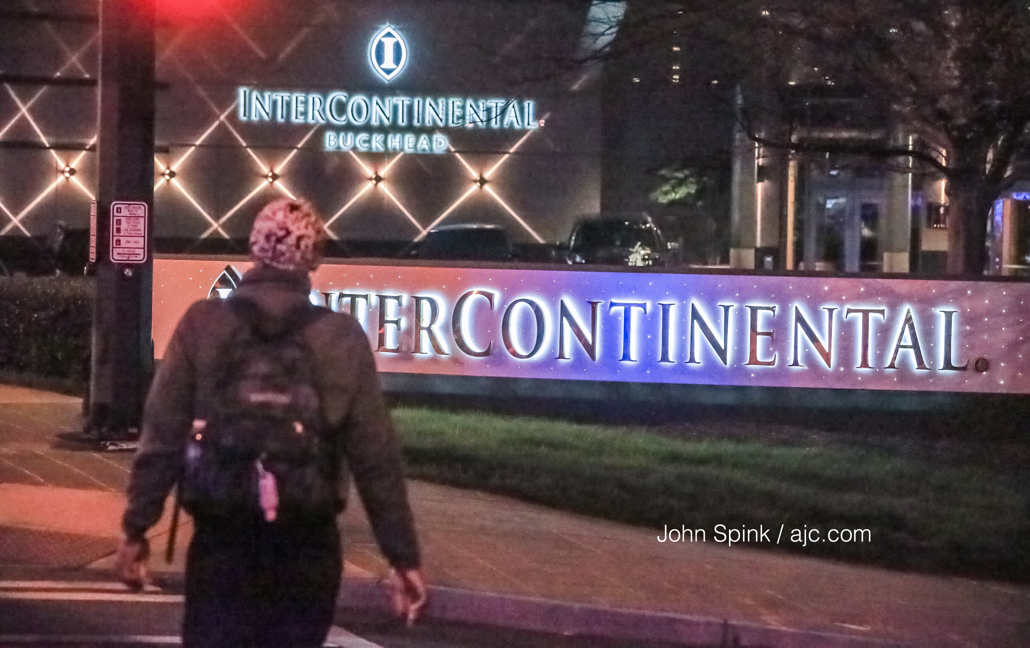 Police gathered evidence Monday where a shooting happened on Peachtree Road. JOHN SPINK / JSPINK@AJC.COM