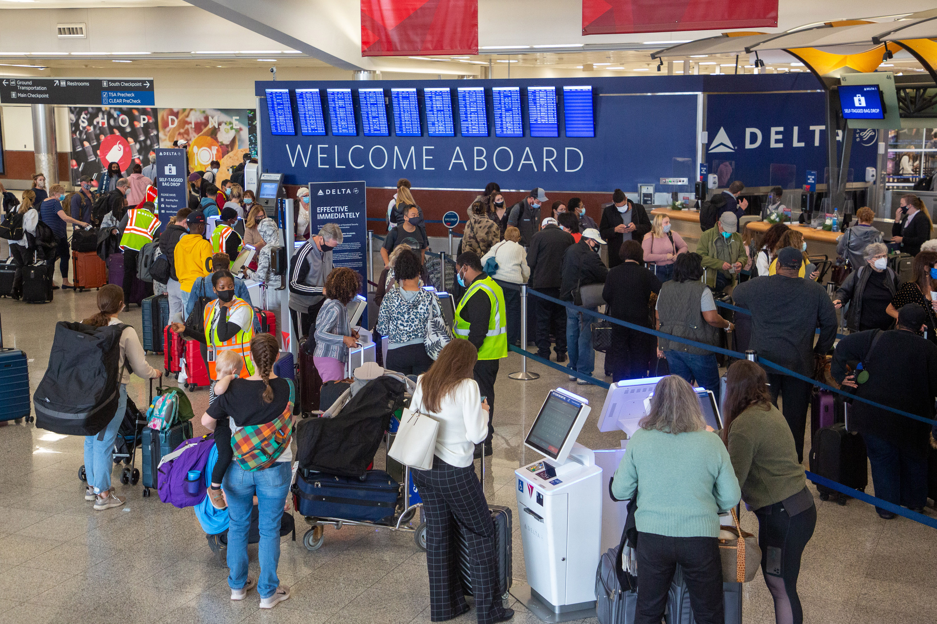 People wait in line at the Delta check-in at the South Terminal at Hartsfield-Jackson International Airport on Monday, December 27, 2021. STEVE SCHAEFER FOR THE ATLANTA JOURNAL-CONSTITUTION