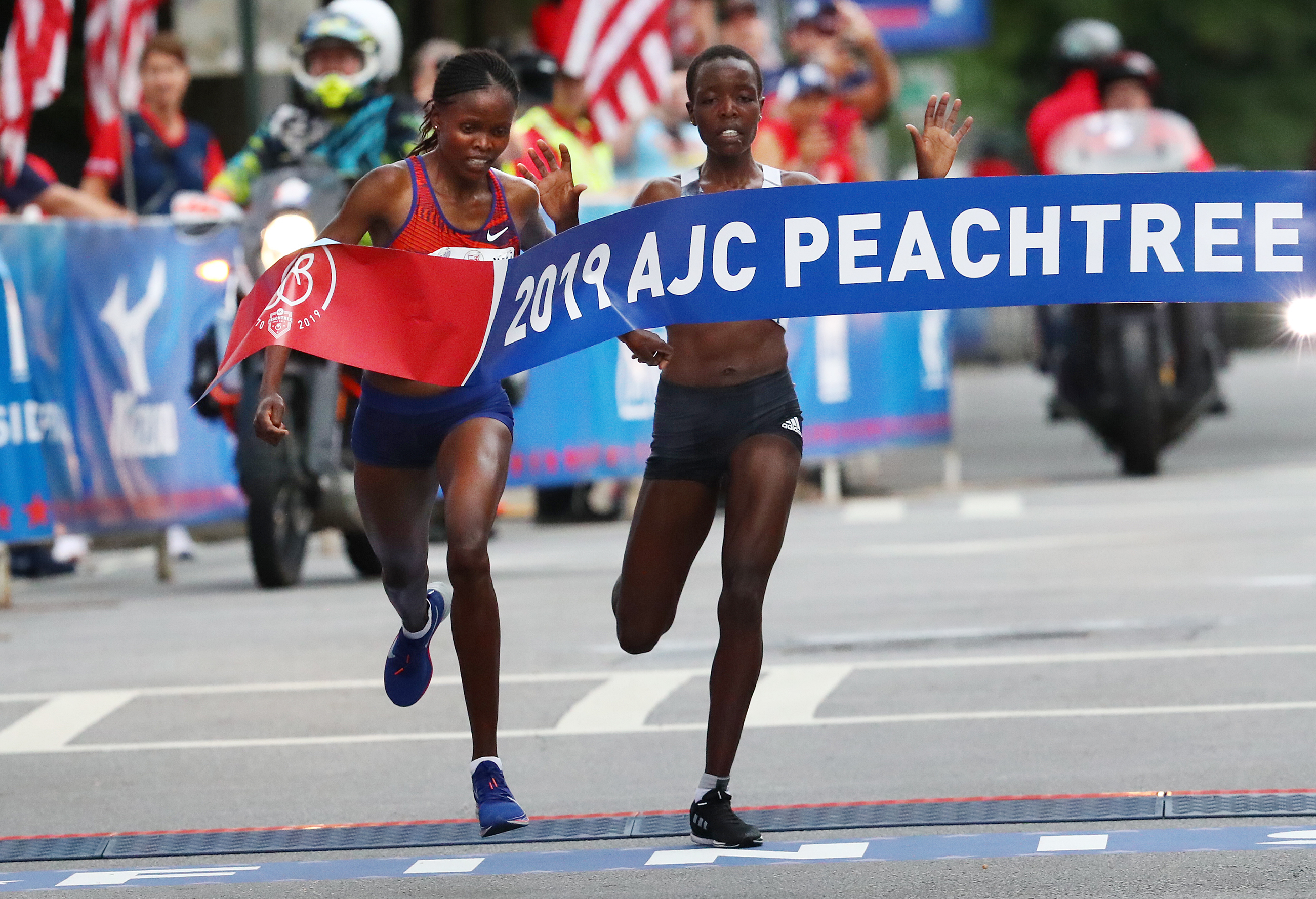 Brigid Kosgei just beats Agnes Tirop to win the 50th AJC Peachtree Road Race with an unofficial record time of 30:22 on July 4, 2019, in Atlanta.