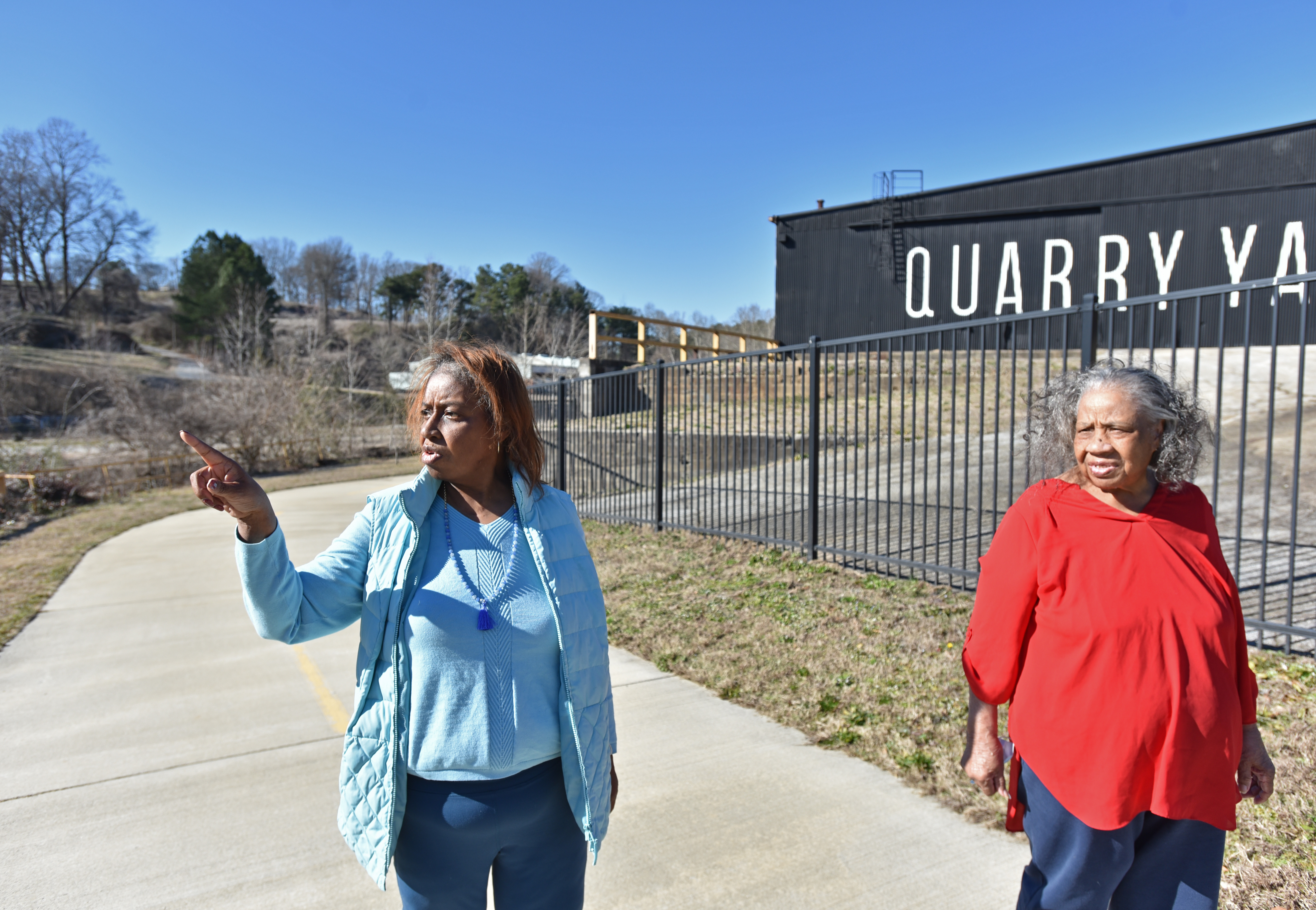 Genia Billingsley and her mother talk as they walk on near the Quarry Yards site on Atlanta's Westside on Tuesday, February 23, 2021. Microsoft bought the property for an office and residential development but has not released detailed plans. (Hyosub Shin / Hyosub.Shin@ajc.com)