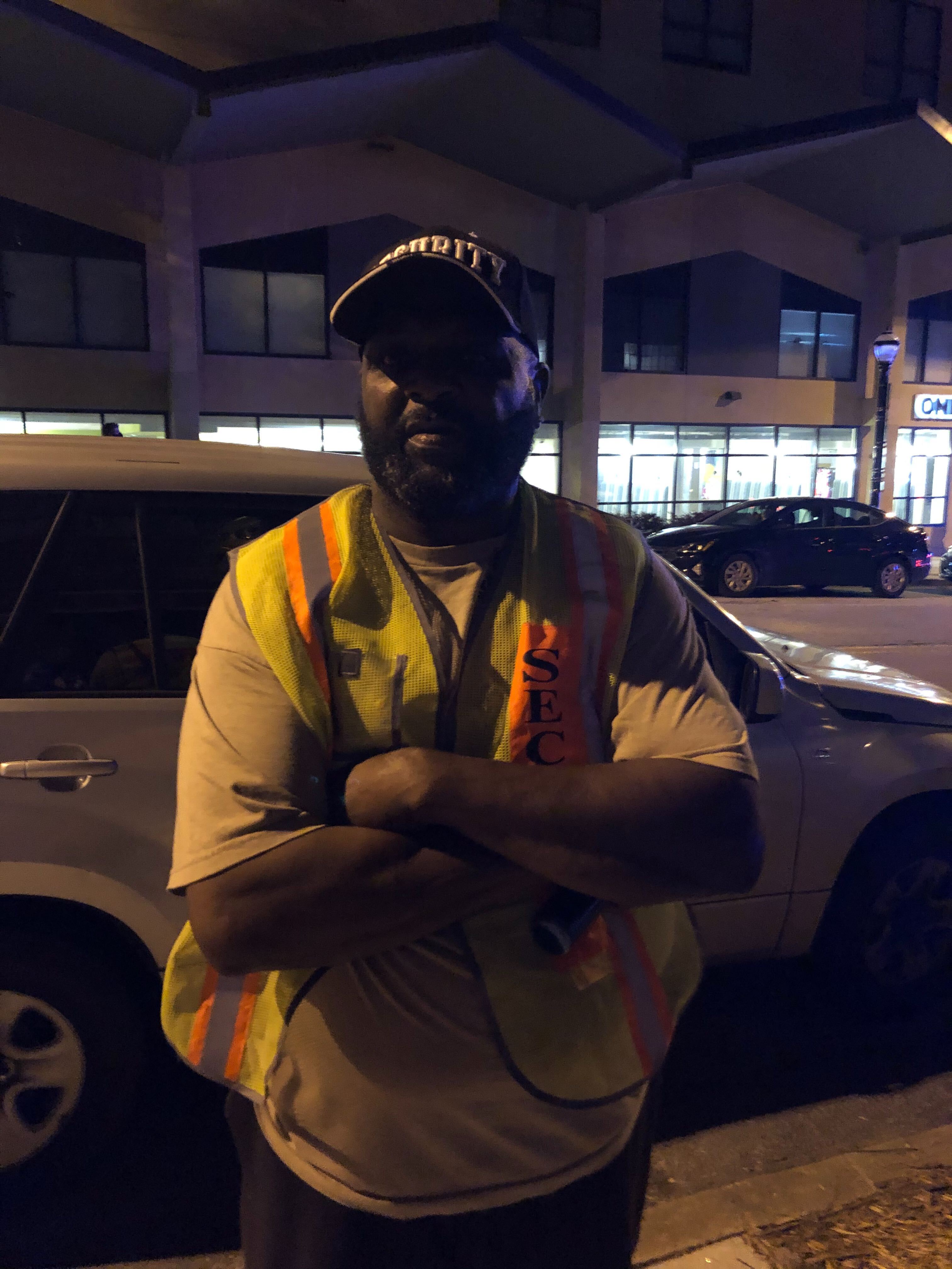Arthur Harden works security at a building where protesters smashed the windows out on John Wesley Dodd Avenue. DAVID WICKERT / AJC