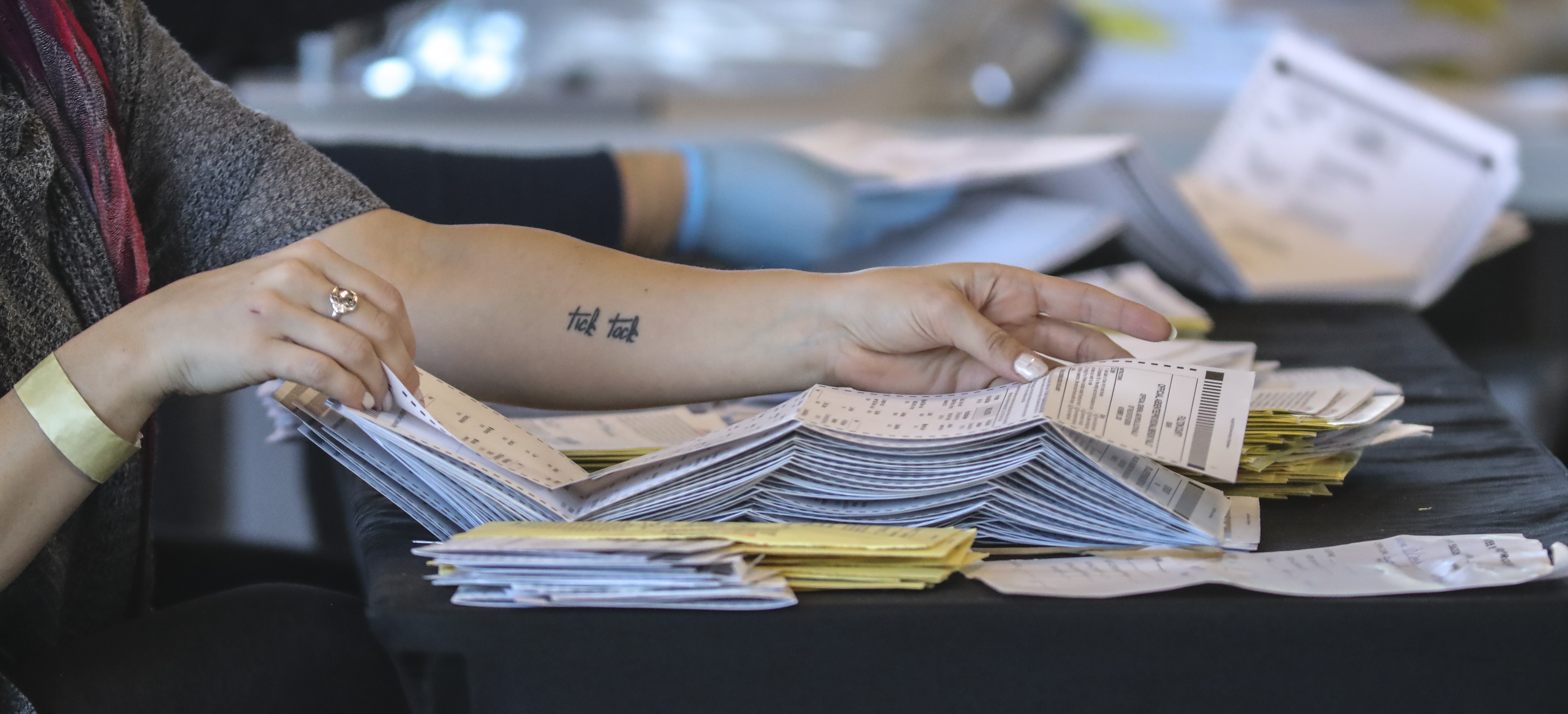 Fulton County election workers count absentee ballots at State Farm Arena on Thursday, Nov. 5, 2020. (John Spink / John.Spink@ajc.com)