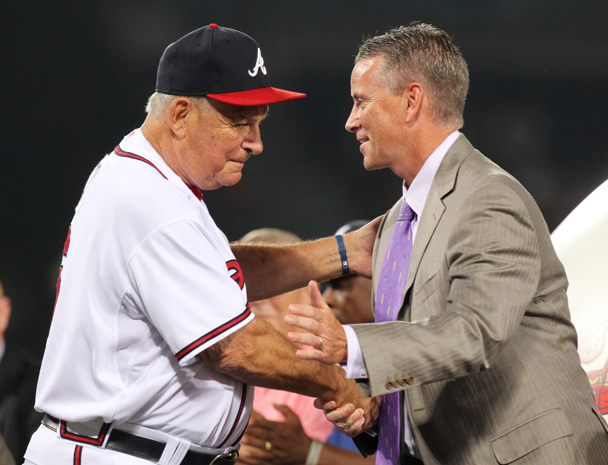 Braves manager Bobby Cox embraces pitcher Tom Glavine on stage during his uniform number retirement in a pre-game ceremony at Turner Field in Atlanta, Friday, August 6, 2010, before the game vs. the San Francisco Giants. Glavine's # 47 is the seventh Braves uniform number to be retired, joining Hank Aaron (44), Eddie Mathews (41), Dale Murphy (3), Phil Niekro (35), Warren Spahn (21), and Greg Maddux (31). Curtis Compton ccompton@ajc.com