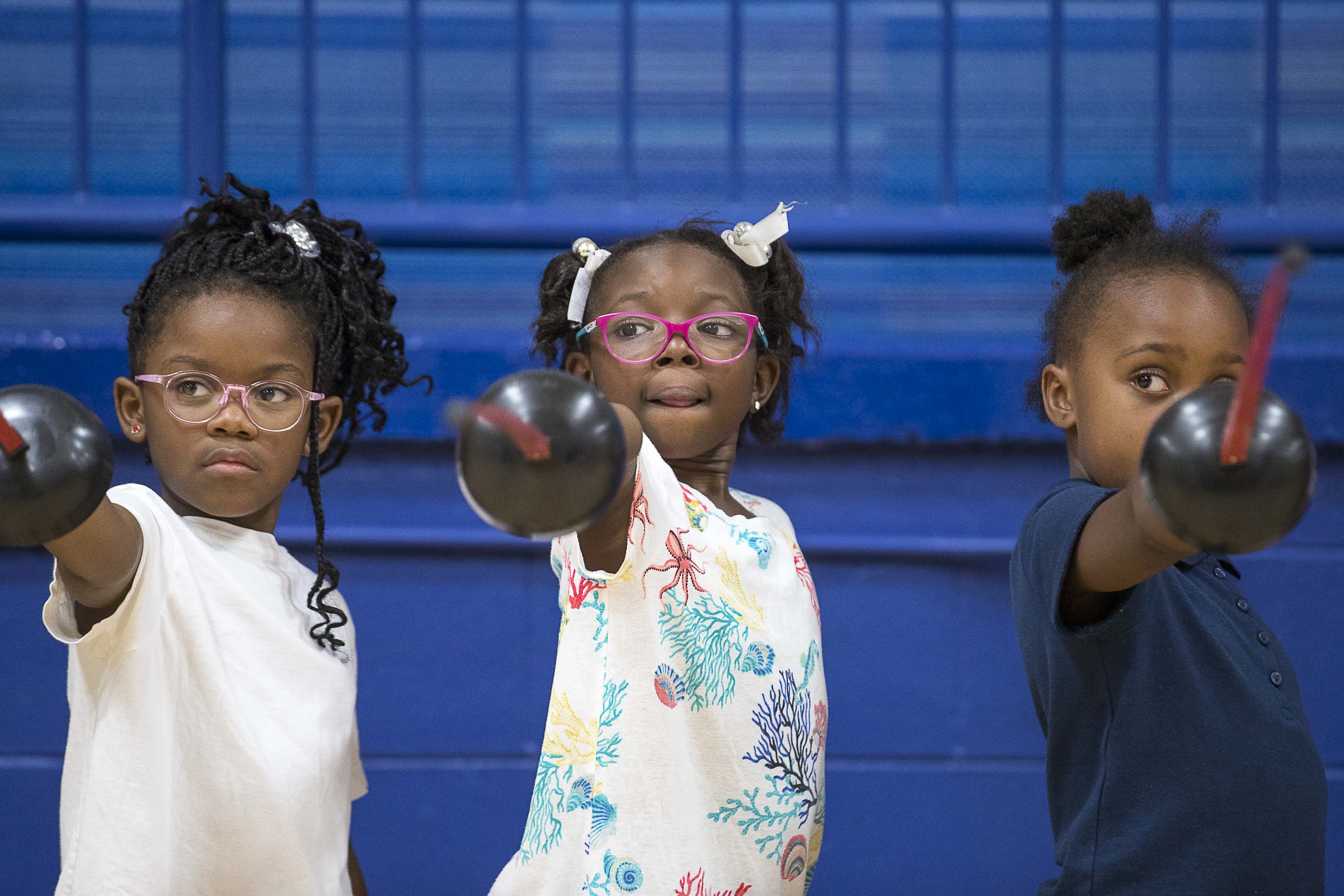 Harper-Archer Elementary school students learn the different stances in fencing while practicing the sport during an after school program in the school's gym, Wednesday, October 2, 2019. (ALYSSA POINTER/ALYSSA.POINTER@AJC.COM)