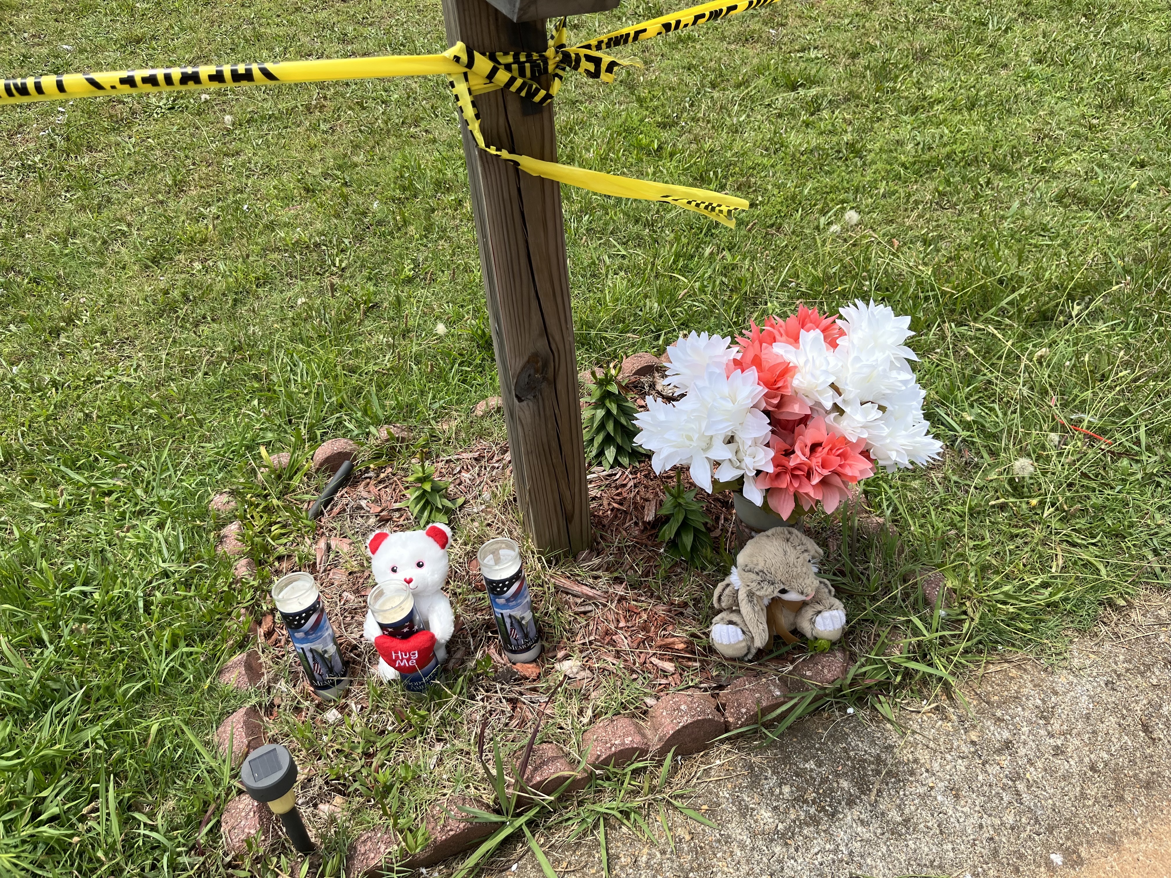 A makeshift memorial was started Saturday, June 25, 2022, after a fatal fire at a Paulding County home claimed the lives of children. (Photo: Alexis Stevens / AJC)