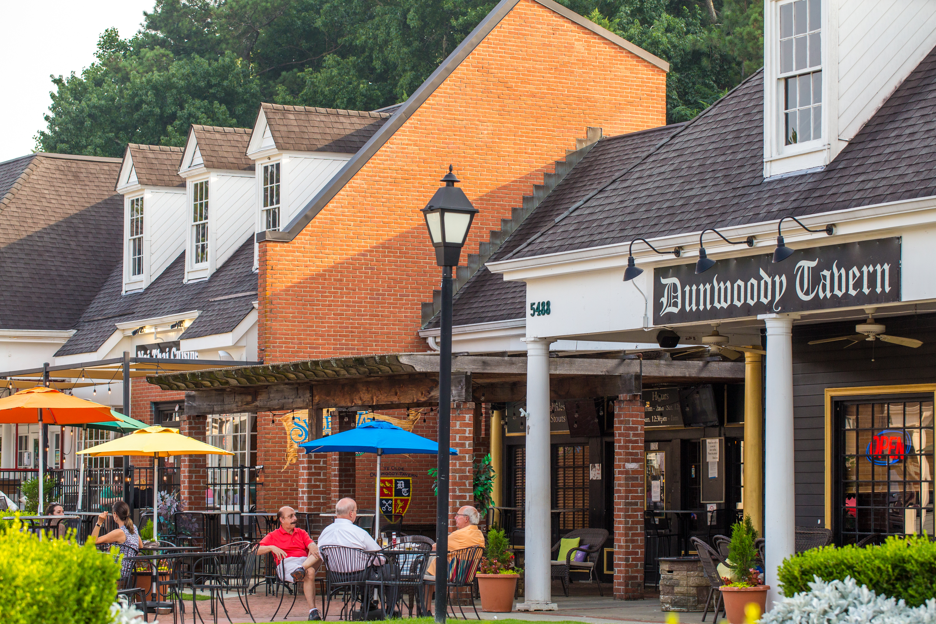 Dunwoody Village businesses, including those in The Shops of Dunwoody strip mall, may soon have a new city center, in the mean time the locals enjoy whatever green space and outdoor patios they can find in the multiple shopping complexes, patched together in the area on Thursday, July 22, 2021. (Jenni Girtman for The Atlanta Journal-Constitution)
