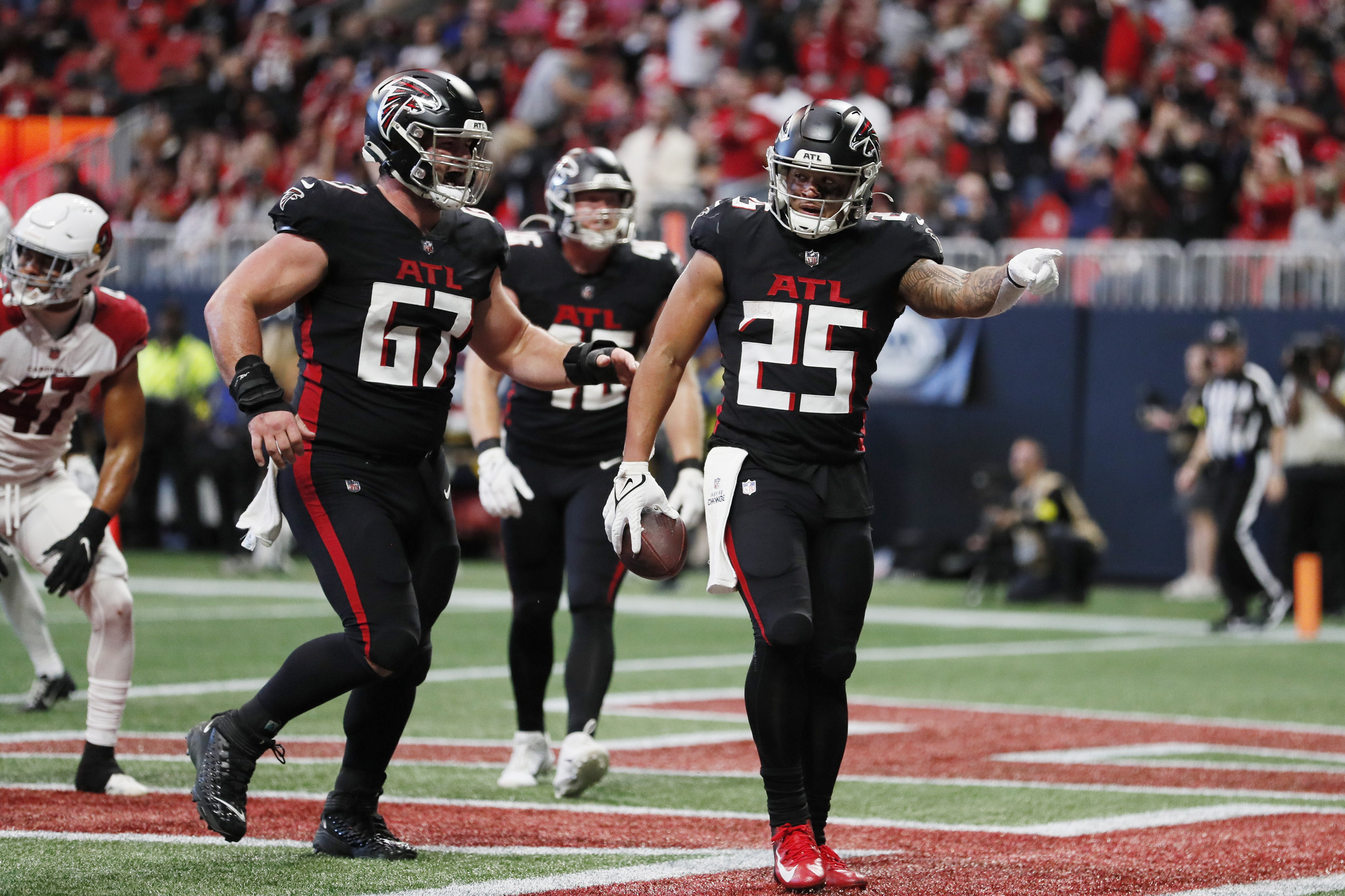 Atlanta Falcons place kicker Younghoe Koo (7) celebrates with Atlanta  Falcons long snapper Liam McCullough (48) after Koo's field goal against  the Chicago Bears during the second half of an NFL football