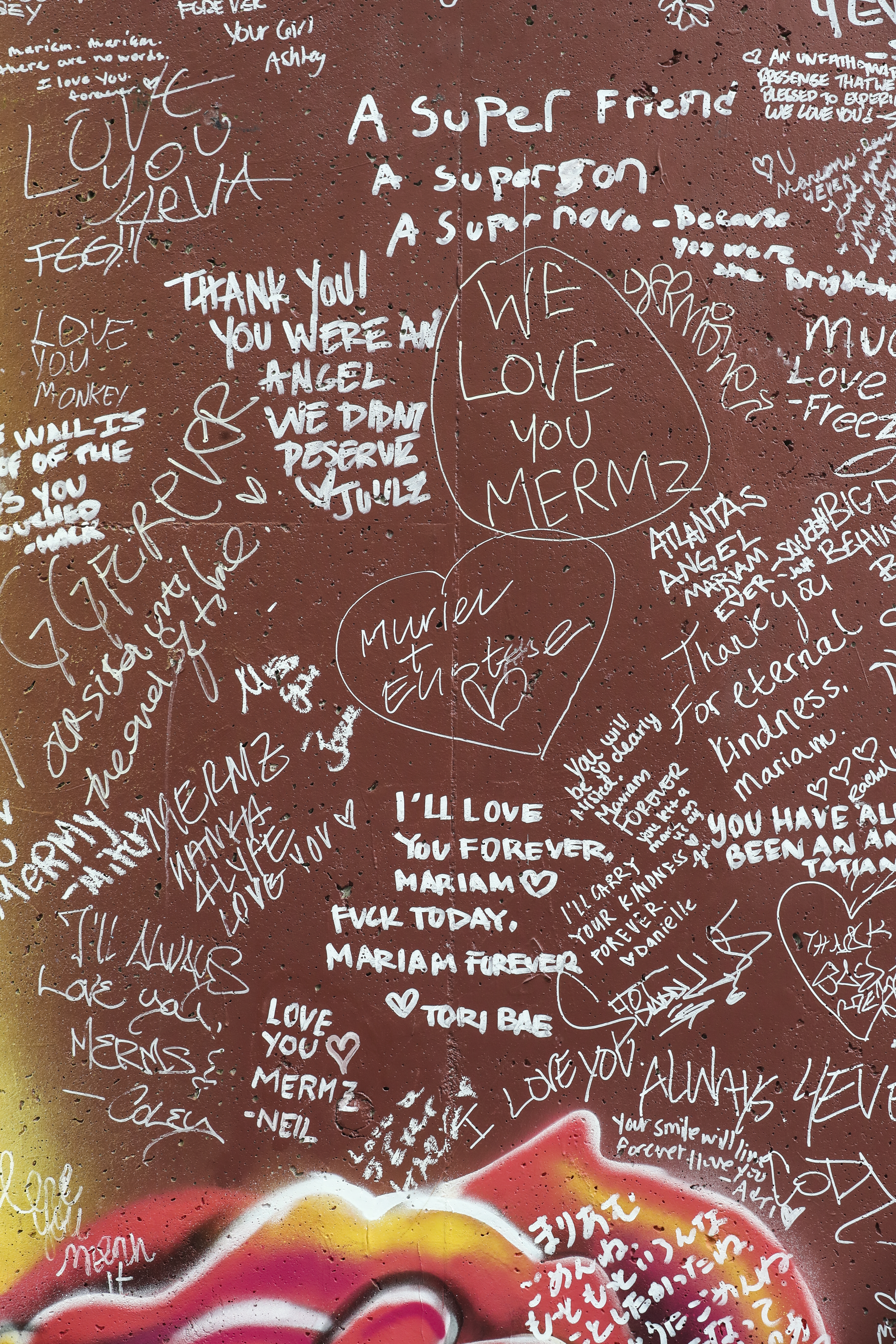 Personal messages to Mariam Abdulrab adorn the memorial mural to her on Wylie Street. As state legislators and others explore ways to combat a recent increase in violent crime, the case of Demarcus Brinkley, the suspect in Abdulrab's murder, highlights the persistent challenge of curbing violence by repeat offenders. (John Spink / john.spink@ajc.com)