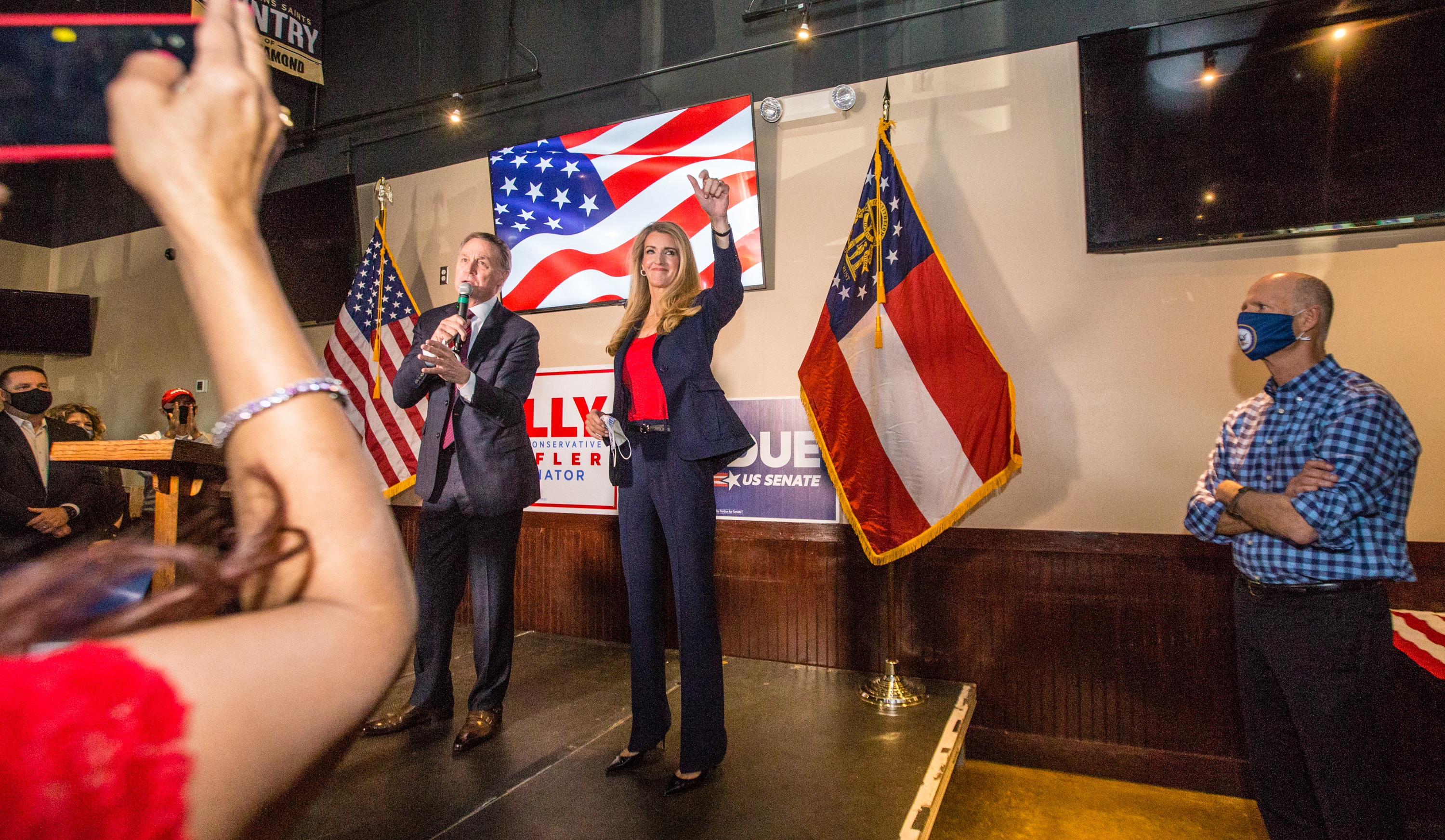 Senators David Perdue, left, Kelly Loeffler, center, and Florida Senator Rick Scott, right, joined together for a rally on Friday, November 13, 2020 at Black Diamond Grill in Cumming, GA. Both Georgia candidates head to a run-off election in January. (Jenni Girtman for The Atlanta Journal Constitution)