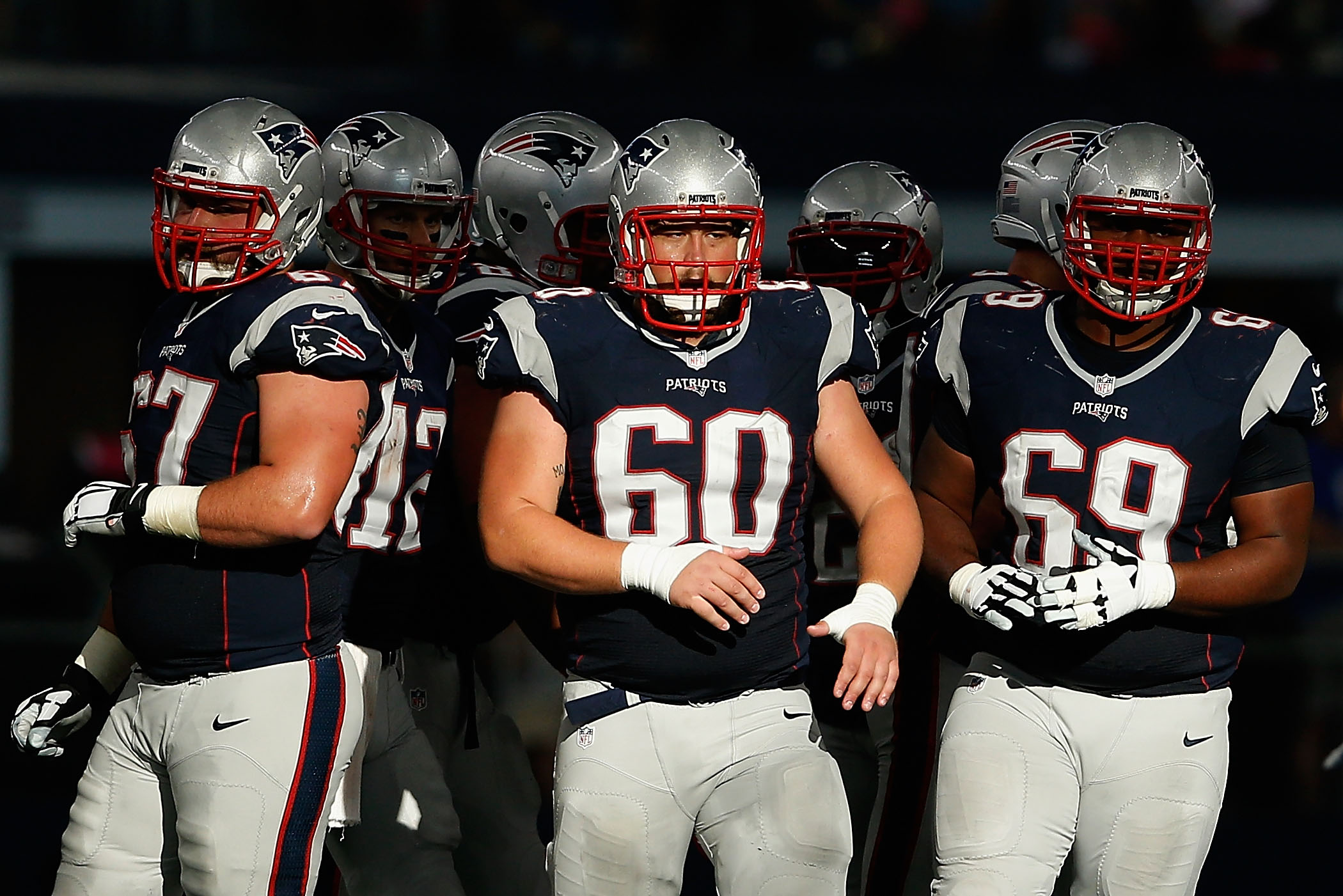 New England Patriots center David Andrews (60) walks off the field